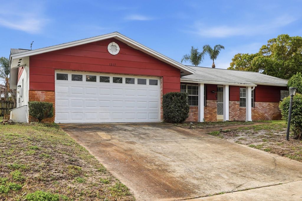 Photo of 1317 N Shangri La Drive, Daytona Beach, FL 32119 (MLS # V4947749)