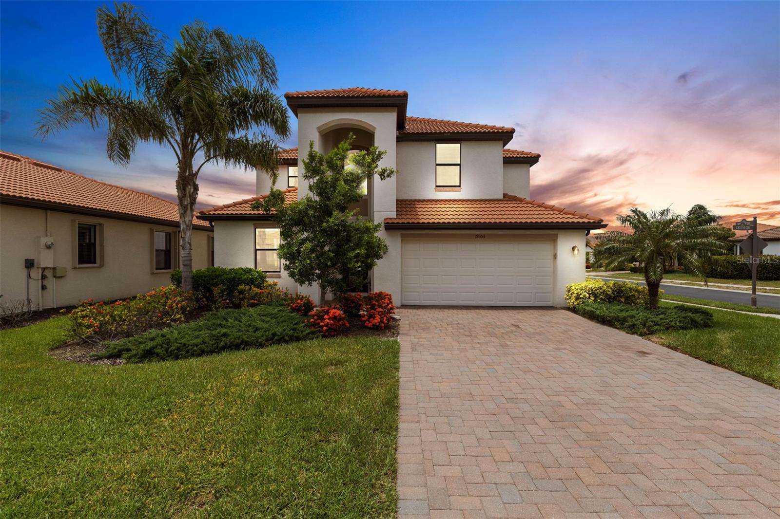 STUNNING MONTE CARLO Five Bedroom, Three Bath, 3 Car Garage, over 3K square feet on a corner lot with fenced in yard is now available and move-in-ready WITHIN THE VENICE SCHOOL SYSTEM! This two-story home, open floor plan with a multitude of upgrades is perfectly designed for luxurious living and entertaining. As you enter, you'll be greeted by tile on the diagonal floor flowing throughout the main living areas, creating an elegant and easy-to-maintain space. Plush carpeting in the bedrooms and on the second level ensures comfort and warmth underfoot. This home is packed with exquisite details, including crown molding throughout, granite counters, and ceiling fans dotting every room for optimal comfort. The heart of the home, the kitchen, is an absolute dream, boasting a convenient breakfast bar with granite, perfect for casual meals or lively conversations. White cabinets add to a light and bright atmosphere of cheer. You'll find ample room for relaxation and recreation with a dedicated entertainment room, ready for movie nights or game days. A large loft space on the second level offers incredible flexibility – imagine a home office, a play area, or an additional lounge. Step outside to your private oasis: an enclosed lanai provides the perfect spot for al fresco dining or simply unwinding while enjoying the serene surroundings of mature landscaping and water view. The3 car garage offers a dedicated above floor attached storage area and painted floors, keeping everything organized and tidy. Beyond the walls of this breathtaking home, you'll discover an incredible community that truly enhances your lifestyle. This friendly neighborhood boasts a large zero entry heated pool and a state-of-the-art fitness center, ensuring you can stay active and refreshed year-round. The location couldn't be more ideal! You're just a short drive to historic downtown Venice offering endless shopping and dining choices, including the vibrant boutiques and top-rated restaurants. For beach lovers, you're in luck! Venice Beach, Nokomis Beach, and the serene privacy of Caspersen Beach are all within easy reach, approximately 3 miles away. Imagine endless days of sun, sand, and relaxation! Don't wait another moment to make this breathtaking home yours. Schedule your viewing today and experience the ultimate in paradise luxury living. Your dream home awaits! 4 Photos have been virtually staged to give you an idea of what is possible!