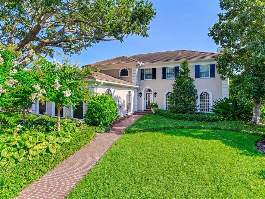 Welcome to Tampa Bay’s TOP gated waterfront neighborhood of Culbreath Isles.
As you wind through the picturesque streets of amazing homes and water views,
you cast off the commotion of the city behind you. You will immediately take notice
of this stunning classic 4 Bed/ 4 Bath Colonial Estate set on a meticulously landscaped 120 x 135
deep water lot with 120 feet of waterfront!!  The over-sized backyard is a boater’s dream complete with a
concrete dock, lift for two boats (25K and 5K lbs), a jet ski, and kayaks. Imagine
walking out your French doors, passing your heated pool with spa oasis and boating
off into the spectacular sunset. Or simply enjoy a quiet morning by the pool with
the Gulf breezes blowing in and admiring the fragrant rose bushes. This Colonial
home features several grand open entertaining spaces with French doors and large
windows throughout, flooding it with natural light. Step into the open foyer and
enter the formal living room with gleaming hardwood floors and crown moldings,
which leads to the large family room with gas fireplace, and the alluring sun-
drenched sunroom. A super bright and airy eat in gourmet kitchen with built-in
stainless appliances overlooks the gorgeous backyard. A formal dining room with
built-in storage, an elegant powder room, and a large laundry room complete the
first floor. Step up to the second floor and enter the sizeable private Owner’s
retreat with ensuite office/sitting room and enjoy the outstanding views of the
waterway below. There is even a second room that is a perfect spot for a personal
yoga retreat, an energizing gym, or private reading room. Separate his and her
walk-in closets, a gorgeous marble bath with a separate shower and a relaxing
soaking tub complete the Owner’s suite. Three oversized additional bedrooms and
two spacious bathrooms perfect this level. Located just an Uber ride to Tampa
International Airport and minutes to Tampa’s top rated public and private schools,
downtown Tampa, luxury shopping, fine dining, and the #1 beaches of America.
Tampa Bay living at its BEST with this spectacular waterfront home in a world class location.