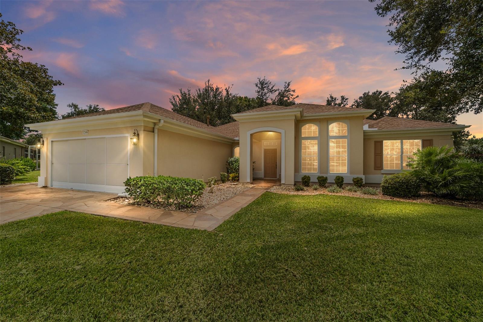 Located on a quiet cul-de-sac with golf course views, this Sanibel has had one owner. This Sanibel has been built with a 3rd bedroom. The roof was replaced in 2021, HVAC in 2010 as well as WH in 2010. The kitchen has corian countertops and a full wall of built-in cabinets in the breakfast nook. The screened lanai was re-screened in 2018. The inside laundry room is being used as an office and the laundry area is the garage. There is a Golf Cart Garage (tandem), screens on both the main garage and Golf Cart Garage and the garage is EXTENDED. There is also a designer driveway, walk and front porch. The backyard is very large with plenty of room for a pool and outside recreation. The home has an irrigation well that is shared by neighbors. This home is located in Del Webb Spruce Creek Golf & Country Club, boasting four (4) 9-hole Golf Courses, Restaurant, Pro Shop, three (3) Pools and Hot Tubs, Softball Field, Fitness Center and so much more! There is a transferrable Termite Bond and Seller is offering a 1 Year Broward Factory Service Home Warranty. Make an appointment to see this home today!