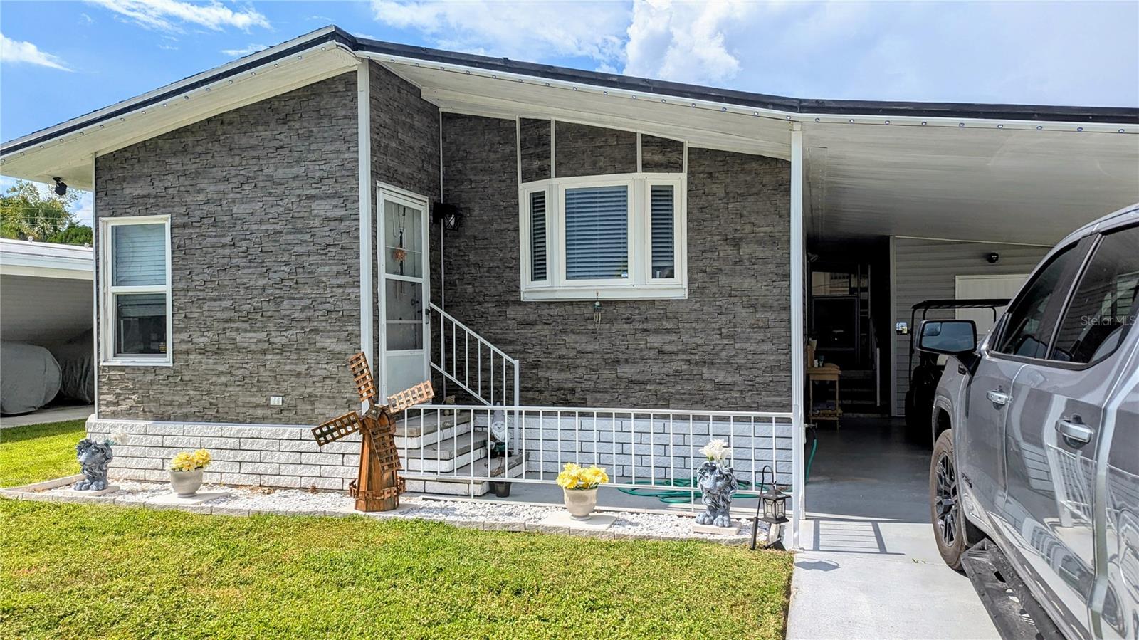 Come and see this well maintained two bed room, two bathroom home with large lania and Sheds for storage, Light and bright and ready for you. This comminty is close to everthing, shopping, resteruants and only about 6 miles from the beach! New plumbing throughout, A/C unit in the Lania and includes a golf cart to ride around on with acceptable terms. This home includes most furniture and is turn key ready for you!