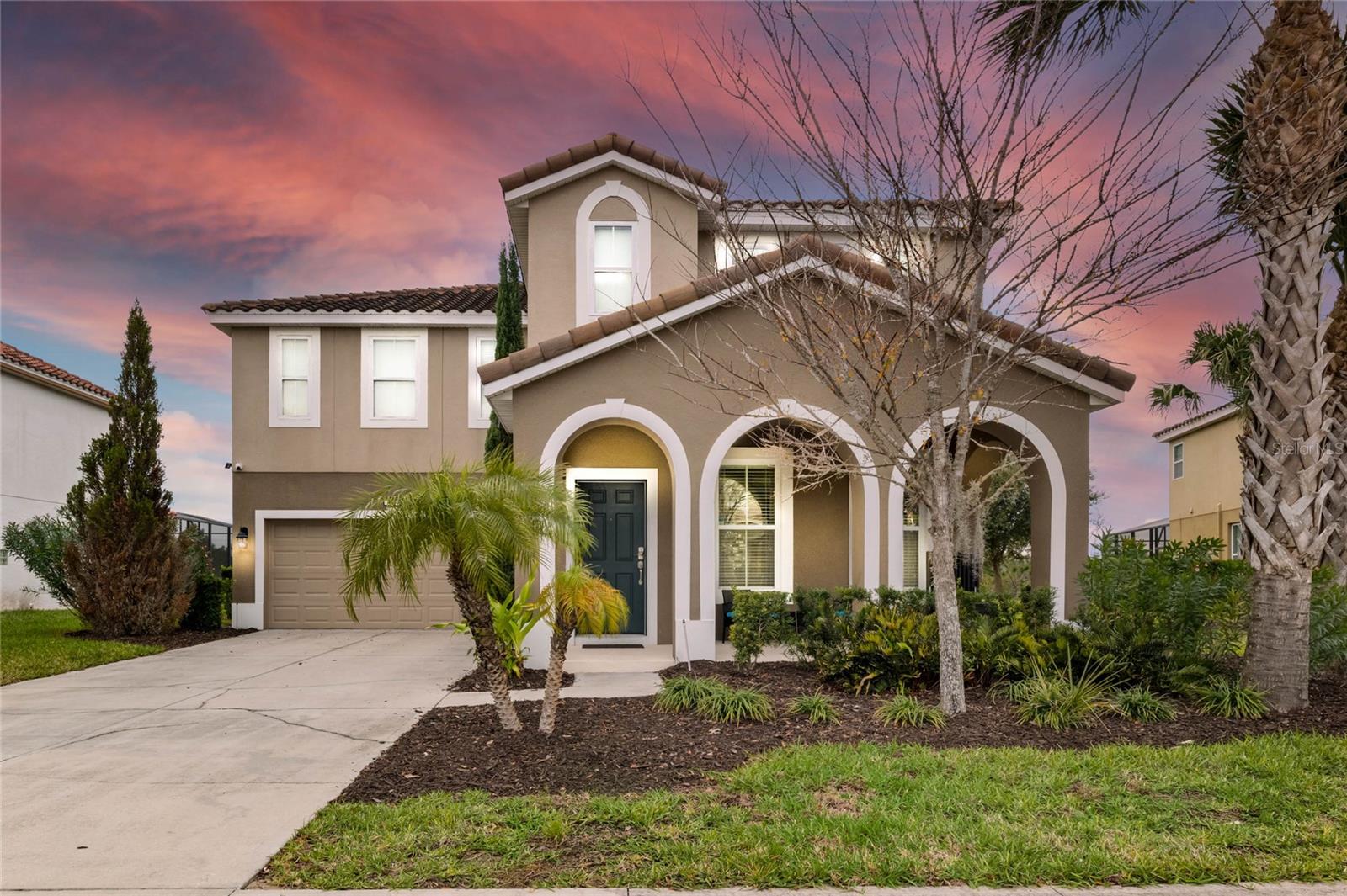 Spacious 7-bedroom, 6-bath home located in the gated Solterra Resort, a community zoned for vacation/short-term rentals just minutes from Walt Disney World®, shopping, and dining. Situated on an oversized 70-foot lot with no rear neighbors, this property offers themed bedrooms, modern furnishings, and an open floor plan with grand ceilings in the living area. The kitchen features granite countertops and stainless steel appliances, while all bathrooms include cultured marble tops. The first floor provides 2 bedrooms and 2 bathrooms, and the second floor includes 5 additional bedrooms and 3 bathrooms, including full suites. Enjoy a private, south-facing screened pool and spa, covered lanai, and a garage converted to a game room. Tile roof, ceramic tile throughout the main living areas, and a well-maintained interior add to the appeal. Solterra Resort amenities include a clubhouse, resort-style pool, lazy river, fitness center, and on-site dining.