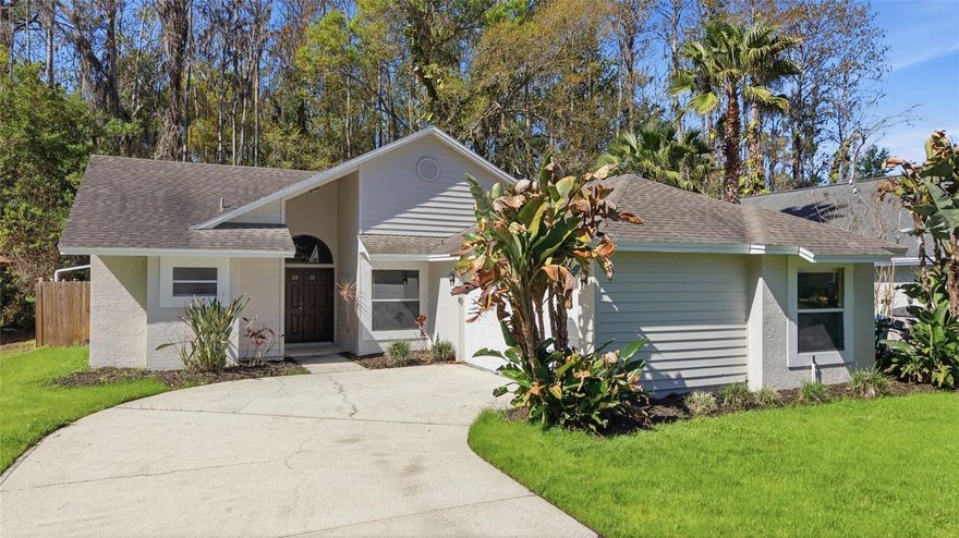 Welcome to 812 Crestridge Drive in Tarpon Springs, a beautifully updated 3-bedroom, 2-bath pool home with a 2-car garage offering 1,656 square feet of living space in a peaceful, established neighborhood. Step inside to discover bright, open living areas with vaulted ceilings, abundant natural light, and updated flooring throughout, creating a spacious and inviting atmosphere. The layout includes a formal living and dining area along with a separate family room featuring a cozy fireplace, perfect for relaxing or entertaining. The updated kitchen features white cabinetry, solid surface countertops, stainless steel appliances, and a stylish tile backsplash, along with a sunny breakfast nook overlooking the pool area. The primary suite offers a private retreat with direct access to the pool area and a spacious en-suite bathroom featuring dual vanities and a walk-in shower. Two additional bedrooms and a full bathroom provide flexibility for guests, family, or a home office. Step outside to enjoy the screened-in pool and covered lanai, complete with a decorative rock waterfall feature, creating a private outdoor oasis surrounded by lush natural landscaping. Located in desirable Tarpon Springs, this home offers convenient access to parks, schools, shopping, dining, and the famous Tarpon Springs Sponge Docks, as well as nearby Gulf beaches. This move-in ready pool home offers the perfect combination of comfort, style, and Florida outdoor living.