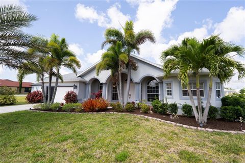 Photo of 888 Boundary Boulevard, Rotonda West, FL 33947 (MLS # O6404514)