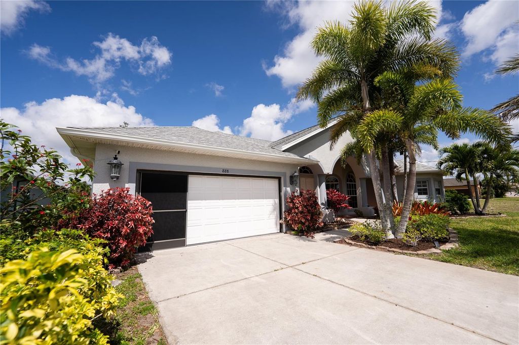 Photo of 888 Boundary Boulevard, Rotonda West, FL 33947 (MLS # O6404514)