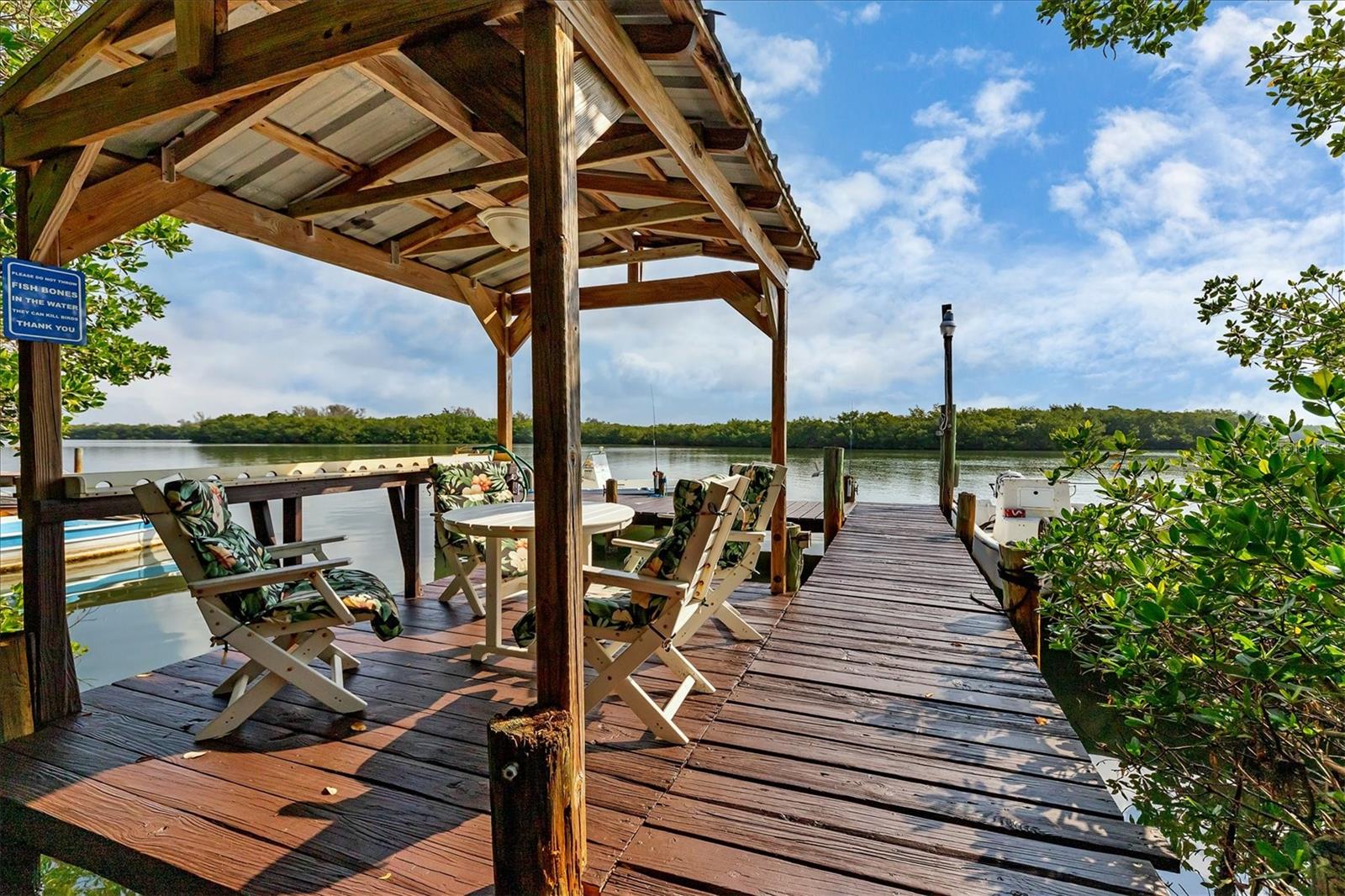Renovations after the Hurricane have been completed. Isn't it time for DOCKTAILS??? You bet it is...enjoy a refreshing beverage while taking in the calm Bay views. This home offers 3 bedrooms, 3 full bathrooms and a screened-in front porch right on the water. The tree lined decks lead you to the private dock with room for your 23 or less foot boat. The home and bungalow are the prefect beach/boating cottage located on the North end of Little G. The main house offers an open living room, dining area and kitchen as well as 2 bedrooms. The larger bedroom offers a king bed, and the guest room has 2 twins. There is also a separate bungalow as a third bedroom directly behind the main house. Enjoy peaceful walks along the most pristine sandy beaches. Little Gasparilla is a PRIVATE island with no public access, Transportation to and from the island is by private boat or water taxi. There are no commercial stores, high rises or automobile traffic. Sand paths are for golf carts or wandering the island. Come watch the dolphins and the manatees...unwind, unplug and sip your favorite DOCKTAIL.
Accommodates: 6 guests maximum SUNDAY check ins must be approved. PETS require OWNER APPROVAL. size and breed limits apply. Addition pet fee of $150 per pet, plus tax. Beds: 1 King, 1 Queen, 2 Twin. Amenities include: Air-conditioning, propane grill, washer/dryer, linens included, dishwasher, microwave, toaster, coffeemaker, blender, dishes/utensils provided
Extras: High Speed Internet and Dish TV Kayaks and Paddle Boards to be used at the guests own risk. Life jackets available on site. Beach chairs also on site. **Reservations booked for less than 5 nights constitutes a higher nightly rate** Sorry, No Smoking. Pets are permitted upon owner approval and require a $150 non-refundable pet fee. **Daily rates may be available. Contact us for details. Please note rates are subject to 12% tax, cleaning and reservation fee. $500.00 Refundable Security Deposit also required.
Located directly in between Sarasota and Ft. Myers on Southwest Florida's Gulf Coast, Little Gasparilla is as close as you can get to Old Florida! There are no paved roads or commercial establishments on the island, only miles of sandy trails flanked by tropical foliage. Take long leisurely walks or travel by golf cart down these paths to explore the beauty of the island. The peaceful, uncrowded beach provides plenty of room for you to bathe in the sun all day, enjoy outstanding shelling, bird watching, swimming, playing with your children, and beautiful water views, but best of all, the brilliant sunsets at the end of each perfect day. There is great fishing to be had in Placida Harbor for Snook, Trout, Redfish, Snapper and more, and in the world famous Boca Grande Pass you can try your hand at Tarpon fishing. Little Gasparilla Island is the ideal place to get away from the mainland madness. Come relax and unwind in a secluded tropical paradise. LGI is for those seeking a respite from the hectic pace of the mainland and the hassles of everyday life. Escape to Little Gasparilla Island where you can Stay a Week or a Lifetime! **PLEASE NOTE: This is a bridgeless, barrier island that is accessed by water taxi or private boat. Call us for details! **NO BOOKING IS CONFIRMED/FINALIZED UNTIL you have been contacted by Tarpon Rental Services staff!