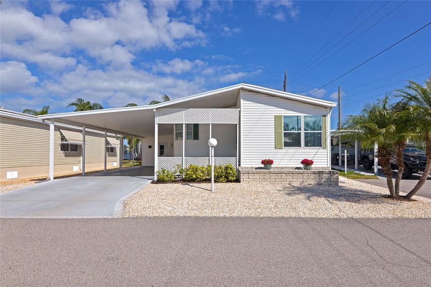 Pristine and move-in ready in Golf Lakes, a gated 55+ manufactured home community with a convenient central location. This well-maintained home features a new roof, A/C, and hot water heater all installed in 2022. Situated on a quiet cul-de-sac, the property offers a low-maintenance xeriscaped yard with no grass to maintain.

The large carport provides space for two vehicles and includes a handy storage room. Inside, you’ll find an open great room floor plan with two bedrooms, including a primary suite with generous closet space and its own private bathroom, plus a separate guest bath. The home is in excellent condition and ready to enjoy from day one.

Golf Lakes offers low fees under $300 per month, a gated entrance, community pool, and amenities. The location provides an easy drive to everything Bradenton has to offer and is just a short trip to the Gulf beaches. Be sure to click the 3D tour for a “like-being-there” experience.