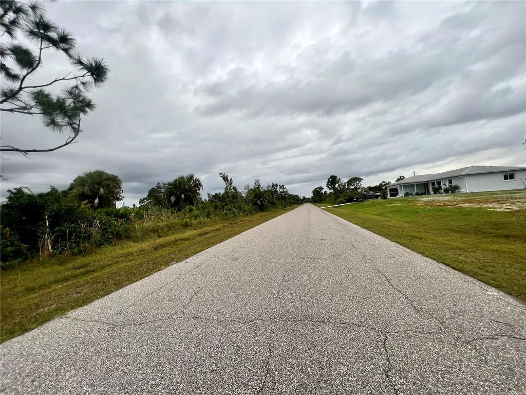 Photo of 12113 Snow Bird Avenue, Port Charlotte, FL 33981 (MLS # C7506756)