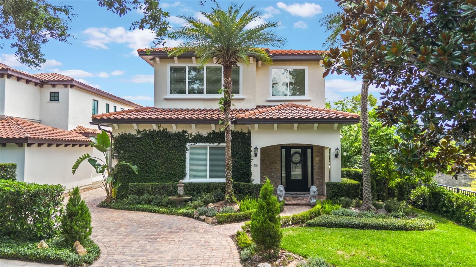 Custom-built and beautifully maintained, this large 3-bedroom home with loft is located in prime Old Winter Park on a quiet cul-de-sac. The interior boasts 20'+ high ceilings, creating a grand and airy atmosphere throughout the main living spaces. High-end finishes include Viking stainless steel appliances, dolomite marble tile flooring, and a thoughtfully designed, functional layout ideal for everyday living and entertaining. The private backyard is a serene retreat, featuring a tranquil self sufficient koi pond, perfect for relaxing or hosting guests. Just minutes from Winter Park Village and Park Avenue, residents enjoy access to fine dining, boutique shops, and cultural attractions, along with top-rated schools and major highways. This move-in ready home blends luxury and location in one of Central Florida’s most coveted neighborhoods.