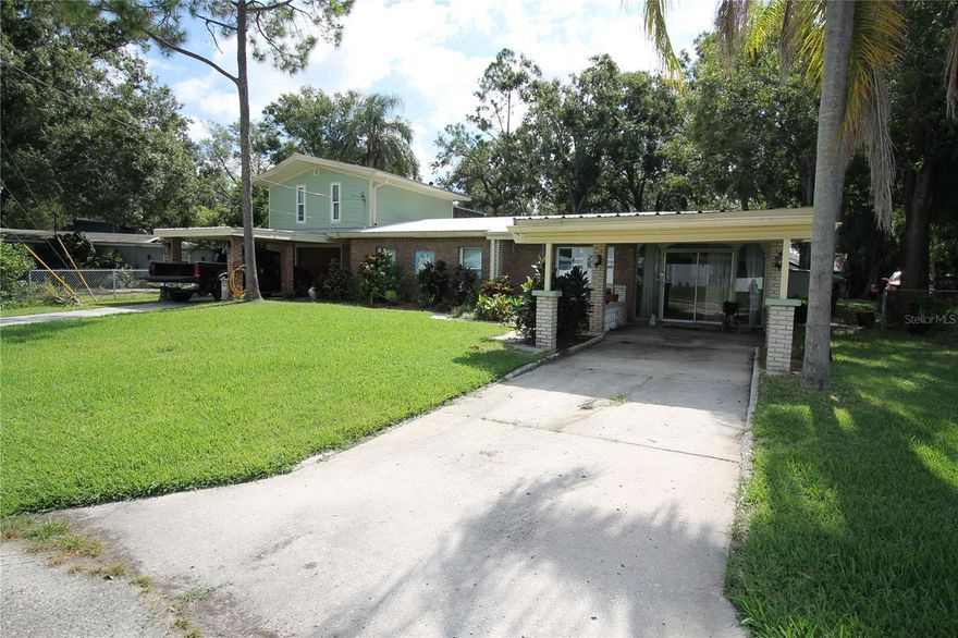 Stellar income property, once restorations are complete. This is truly a unique opportunity for a savvy investor boasting a 20% cap rate!  This is 3 tax parcels being offered together. All structures were flood damaged in 2024 and are down to studs awaiting renovations. All big ticket items are finished. Metal roof, HVAC, windows, septic, and electrical are all working. Needs drywall, kitchens and baths, flooring and millwork. Main home can be lived in and one could rent out the other assets to pay the mortgage, or rent out everything for maximum income potential. The second home was used as 7 efficiency rooms with shared kitchen and laundromat. The rooms feature a private entrance and separate electric meter. There are 6 RV pads, also separately metered, and currently half rented. The main home could also be turned into 7 efficiency rooms with shared kitchen for even more income potential. You will have no shortage of tenants due to proximity to the Port of Tampa, 10 minutes to Ybor city, 10 minutes to Amalie Arena, and the gateway to everything Tampa has to offer. Before the hurricanes of 2024 this property had rents over $10,000 monthly, not including the main house. Do not pass up this amazing opportunity!