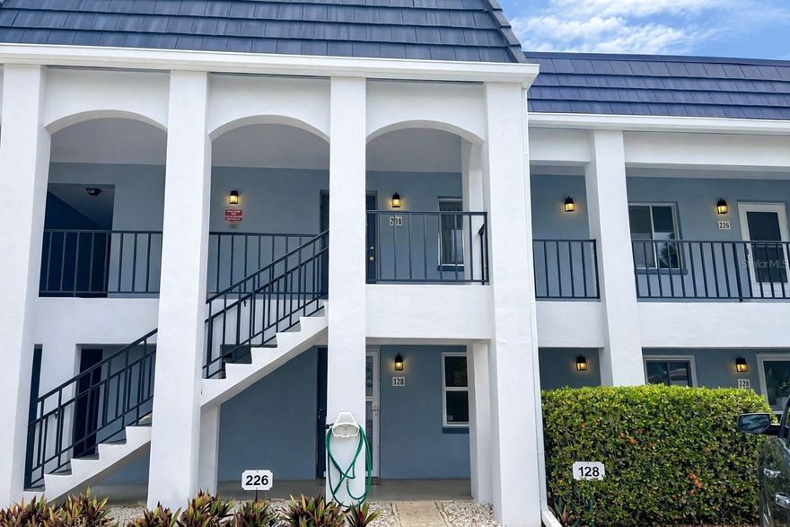 Updated 1BR/1BA condo with a bright open floor plan and modern finishes throughout. Features include contemporary glossy flat-panel soft-close kitchen cabinets, quartz countertops, and newer appliances. Recessed LED lighting in ceilings and under cabinets, plus ceramic tile flooring throughout. Stylish floating cabinets in the living area and bath, and an updated tile shower with built-in seat.  Enjoy the convenience of a full-size stackable washer/dryer, walk-in closet, and a versatile bonus area with desk and Murphy bed—perfect for guests or a home office. Custom blinds included.  This 55+ community is located in a well-maintained complex with elevator access and a beautiful pool area featuring bathrooms, lounge chairs, and a gazebo. Prime location close to beaches, restaurants, and downtown St. Petersburg.