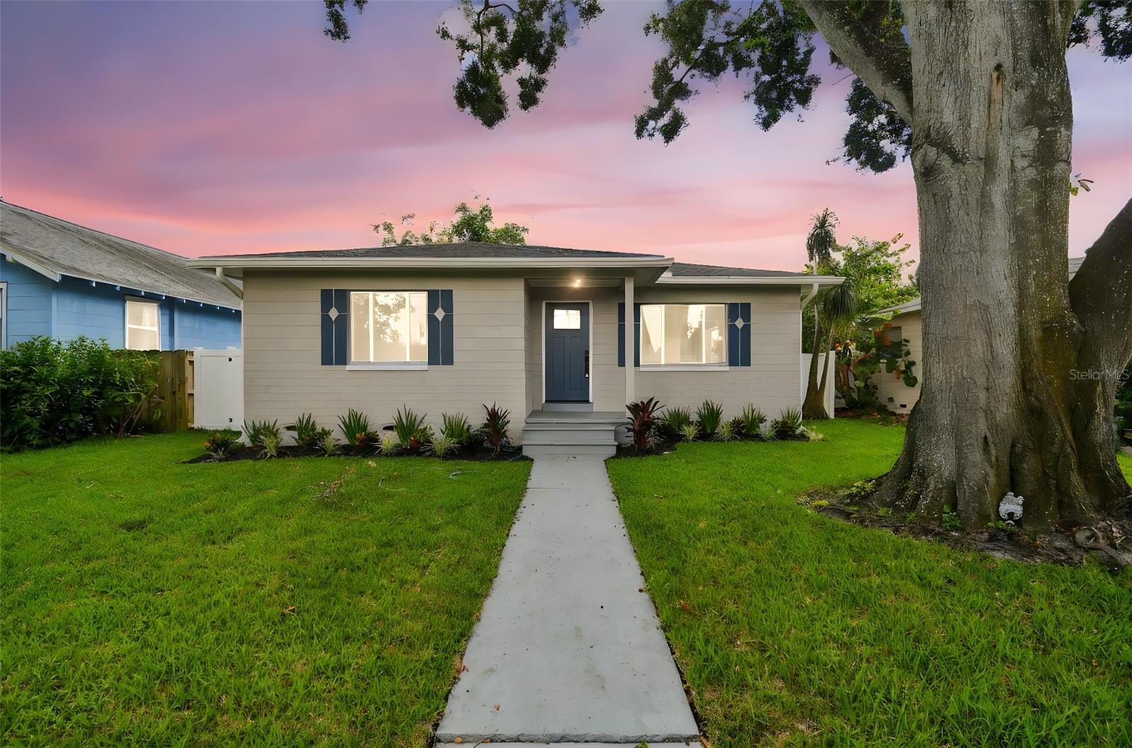 Welcome home to this beautiful 2 bedroom 1 bath KENWOOD St. Pete home! If you are looking for the perfect starter or family home, look no further. GREAT FENCED BACKYARD with enough room for a pool or additional storage. This home has been TOTALLY RENOVATED by the owner and includes upgrades perfectly fit for a first time home buyer or growing family. The totally remodeled kitchen features solid wood cabinets, granite countertops, stainless steel appliances, custom backsplash, and a designer faucet. The bathroom features the same level of upgrades including custom vanity, granite countertops, designer tile, and new hardware. Other upgrades include Newer water heater, NEW AC (2025) NEW MOTORIZED ACCESS GATE (2025) refinished original hardwood mixed with new tile flooring throughout, new paint, new LED light fixtures, and MORE!! All of these amenities and upgrades are complimented by the unique curb appeal of the home which sits on a quiet street! This home has many desirable features and is a must see. Please call us or use ShowingTime to set up a showing today!