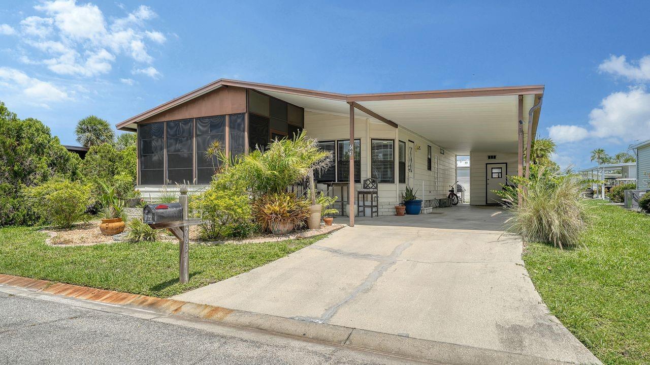 Tucked away on a peaceful, WOODED CUL-DE-SAC, this FULLY FURNISHED 2 BEDROOM, 2 BATH home offers a rare combination of PRIVACY, AFFORDABILITY, and access to the FLORIDA LIFESTYLE so many are searching for. Located in the GULF-ACCESS WATERFRONT COMMUNITY of HARBOR COVE, you’ll have use of a PRIVATE MARINA and BOAT RAMP, making spontaneous days on the water, SUNSET CRUISES, and FISHING TRIPS an easy part of everyday life. Inside, the OPEN FLOOR PLAN flows effortlessly, featuring ENGINEERED HARDWOOD FLOORING, CEILING FANS THROUGHOUT, and an AIR-CONDITIONED LANAI perfect for morning coffee, afternoon reading, or entertaining friends. The kitchen and living spaces are welcoming and functional, while the PRIMARY SUITE offers a WALK-IN CLOSET and EN-SUITE BATH for added comfort. Recent upgrades include a NEW ROOF (2022), NEW A/C AND DUCTWORK (2023), and WASHER/DRYER HOOKUPS conveniently placed in the GUEST BATHROOM CLOSET. Step outside and into a true RESORT-STYLE COMMUNITY. Enjoy TWO SPARKLING POOLS, a HOT TUB, TENNIS COURTS, BOCCE BALL, a MODERN FITNESS CENTER, and one of the LARGEST CLUBHOUSES in the area. Whether you’re looking for activity or relaxation, this 55+ NEIGHBORHOOD has it all, including COMMUNITY EVENTS, CLUBS, and SOCIAL GATHERINGS that make it easy to feel at home.