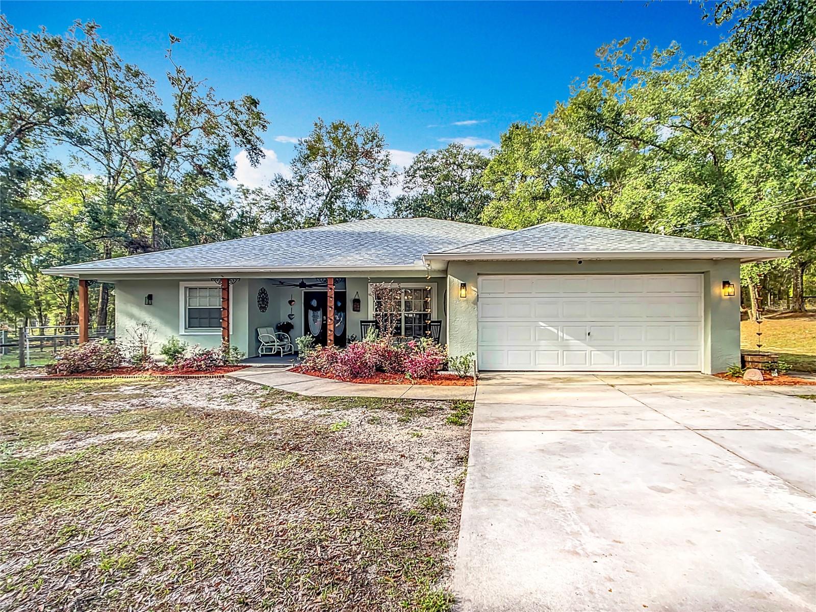 SELLERS ARE MOTIVATED - RELAX IN QUIET COUNTRY COMFORT in this adorable farmhouse style 3 bedroom 2 bath house on 2.7 fully fenced and gated acres in Brooksville. Privately set back in the woods, this house boasts a welcoming front porch with picturesque views of the adjacent pasture beyond. Sip your coffee and watch the sunrise or kick back and enjoy end-of-the-day cocktails as twilight dances on the beautiful pastoral view around you. This charming home has a 2-car garage, 1-stall horse barn with storage or it can be converted back into 3 horse stalls. Crossed fenced pasture, and 16 x 20 ft storage shed/work shed. Plenty of space for your horses and favorite toys! You can also splash your troubles away in the brand new (2024) inground pool with paver patio that is perfect for entertaining. Other features include a new well pump (2024), newer roof (2020), septic system (2022), updated kitchen (2021) with new appliances (2024), updated bathroom (2021), new laundry room (2024) and newer air conditioner (2015). Located off State Route 50 (Cortez Blvd), close to the Suncoast Parkway, this home offers country living while being convenient to local shopping, restaurants, the Tampa International Airport (50 minute drive), Weeki Wachee State Park and river, Homosassa Springs and State Park, Crystal River and Three Sisters State Park, Pine Island State Park beach and several Hernando County scalloping locations. It truly has it all. Come see it before it’s gone. Seller to confirm all measurements.