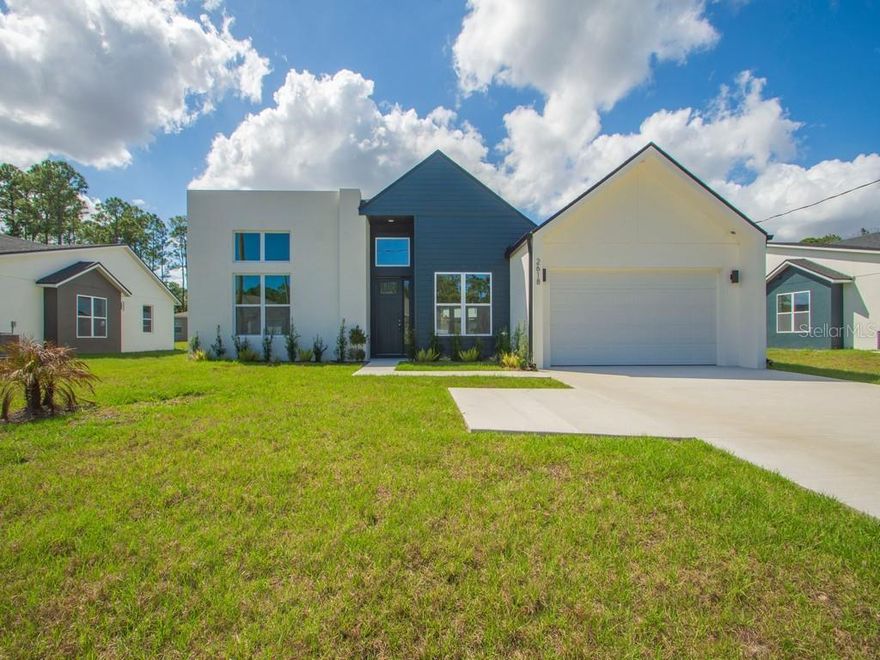 Brand new construction featuring unique modern architecture, soaring ceiling in entryway, and upscale finishes throughout. This thoughtfully designed 4-bedroom, 3-bath residence includes a private office, soaring ceilings, and an open-concept floor plan ideal for everyday living and entertaining. Chef’s kitchen offers soft close cabinetry, stylish finishes, abundant counter space, and seamless flow into the main living areas. Luxurious primary suite features a spa-inspired bath and oversized walk-in closet with direct access to laundry room. Additional highlights include spacious secondary bedrooms, ample storage, mudroom walkway with bench leading to a 2-car garage. **Seller offering up to $10,000 toward rate buy-down assistance to qualified buyers.** Builder warranty guarantees peace of mind. Exceptional opportunity to own a beautifully designed modern home with high-end details throughout.