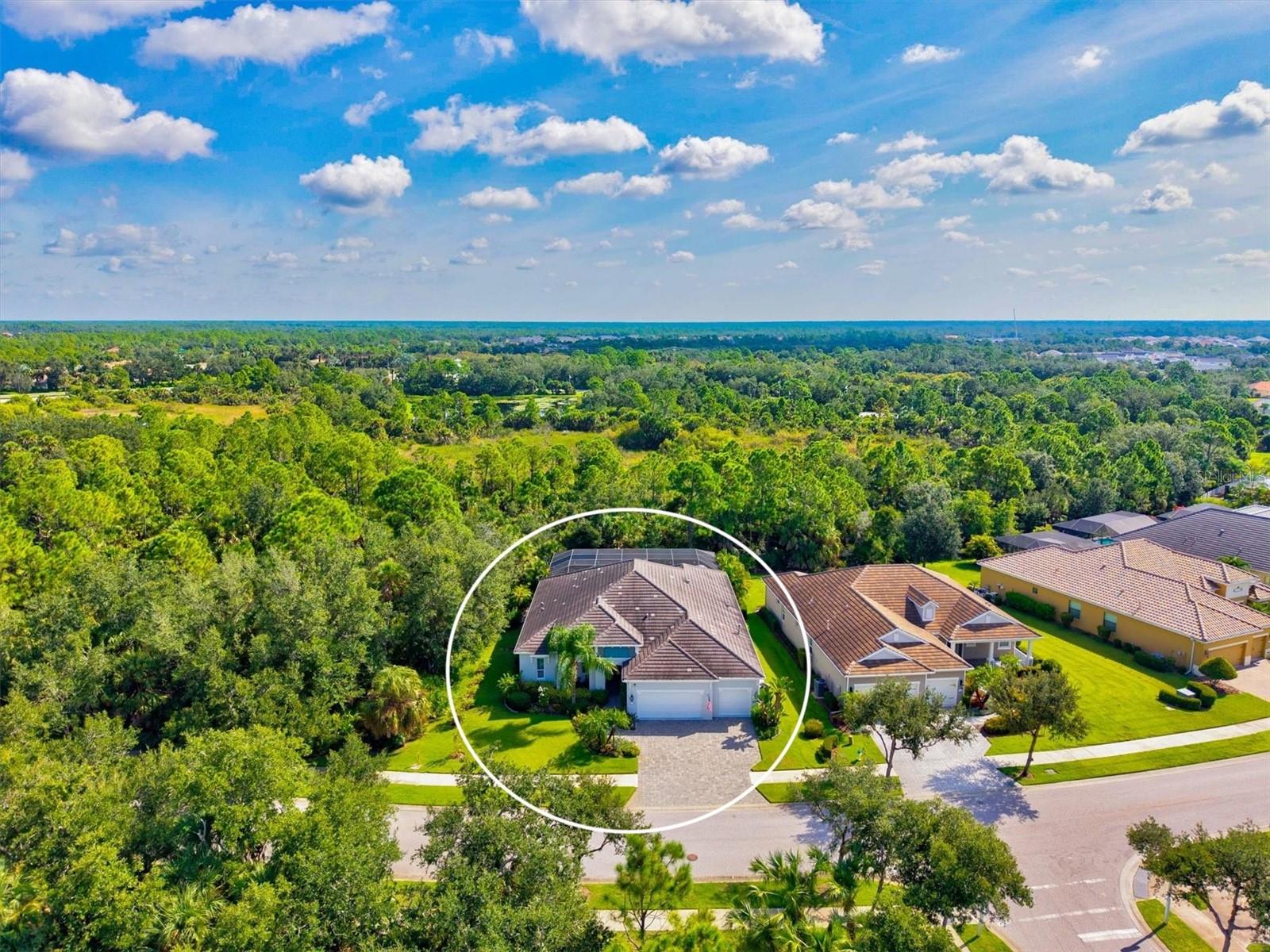 Experience the pinnacle of Florida living in this highly upgraded 3-bedroom plus den home with a 12x18 club room, 3 full baths, and an extended 4’ 3-car garage in the sought-after Grand Palm community of Wellen Park. Combining privacy and luxury, this residence is both a private retreat and an entertainer’s dream.
Owned by the original owners and set on an oversized .27-acre lot with lush landscaping, curbing, seamless gutters, and solar exterior cameras, this home is uniquely private with no homes across the street and only one neighbor to the east — perfect for relaxation and enjoying Florida’s outdoor lifestyle.
Step inside and you are welcomed by an open, light-filled floor plan with soaring 11’ tray ceilings, crown molding throughout, 8’ interior doors, and 5.25” base trim. The chef’s kitchen is a showpiece with an oversized granite island that includes front-side storage, 42” cabinetry, built-out custom pantry, under-cabinet lighting, and stainless appliances highlighted by a natural gas range with oven/microwave combo and a new Bosch dishwasher. The layout seamlessly connects the kitchen, dining, and great room, creating a space perfect for gatherings or quiet evenings at home.
The primary suite is a retreat of its own with plantation shutters, a custom built Closet system, and even a built-in wall mirror that conceals a jewelry storage rack. The spa-like primary bath offers dual sinks and an oversized Roman shower tiled to the ceiling. The additional bedrooms are connected by a Jack-and-Jill bath with dual vanities and a walk-in shower, while the versatile club room can easily serve as a fourth bedroom, media space, or work out room. Plush patterned carpet adds comfort in all bedrooms.Step out to one of the largest lanais in the community — your own private outdoor retreat. Complete with an included outdoor sauna, it’s the perfect space to relax and recharge.
The oversized heated saltwater pool features a sun shelf, fountains, and remote-controlled color-changing lights, complemented by a relaxing spa tub. A full granite outdoor kitchen with refrigerator and wine fridge makes entertaining effortless, while Storm Smart hurricane shutters provide peace of mind and allow this outdoor living area to be enjoyed year-round.
The home also includes thoughtful upgrades for convenience and efficiency: a Lennox AC replaced in 2025, block foam insulation, natural gas Generac generator, ceiling fans throughout, a painted garage floor with storage racks, and pull-down attic stairs with floored storage above. Peace of mind: this home is outside of a designated flood zone so flood insurance is NOT requited.
Grand Palm is one of Wellen Park’s premier gated communities, offering resort-style amenities including two pools, a fitness center, tennis courts, 8 pickleball courts, bocce, volleyball, basketball, playgrounds, and miles of walking and biking trails. Just minutes from Venice’s pristine Gulf beaches, shopping, dining, new Costco and cultural attractions, this home combines modern luxury, unmatched privacy, and the very best of the Florida lifestyle.
