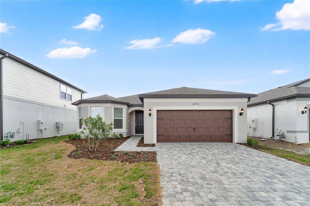 Photo of 6573 Asbury Barnes Lane, Wesley Chapel, FL 33545 (MLS # O6398230)