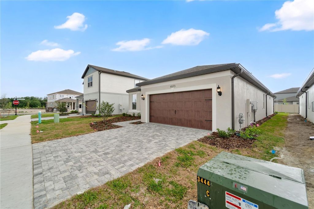 Photo of 6573 Asbury Barnes Lane, Wesley Chapel, FL 33545 (MLS # O6398230)