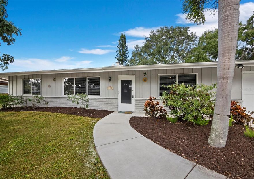 Don’t miss this adorable South Gate gem!  The location could not be more convenient – walk to the Crossings at Siesta Key Mall and less than a mile to the north bridge to Siesta Key itself! For those with school-age children, the close proximity to Brookside Middle School and Southside Elementary zoning are great perks. Completely updated inside with an elegant kitchen (granite, pretty backsplash, stainless appliances), chic wood-look flooring throughout, a charming fireplace, and recently renovated baths, it is move-in ready! Ideally positioned for ultimate convenience to the many amenities of Sarasota, with wonderful possibilities from a full-time or seasonal abode to a prime investment opportunity. The space inside is used really well, with nice spacious bedrooms and a split-bedroom plan, and outside you’ll enjoy a covered screened patio and HUGE fully fenced backyard! There is currently a fun fire pit and open land, so the large yard can be a blank canvas for your outdoor Florida dreams. There is plenty of space for a pool, if that is your desire, or maybe you prefer to plant an edible garden? The choice is yours and this lot can accommodate it all!  An oversized 1-car garage with separated extra storage space and laundry completes the package. Easy to show, schedule your visit today!