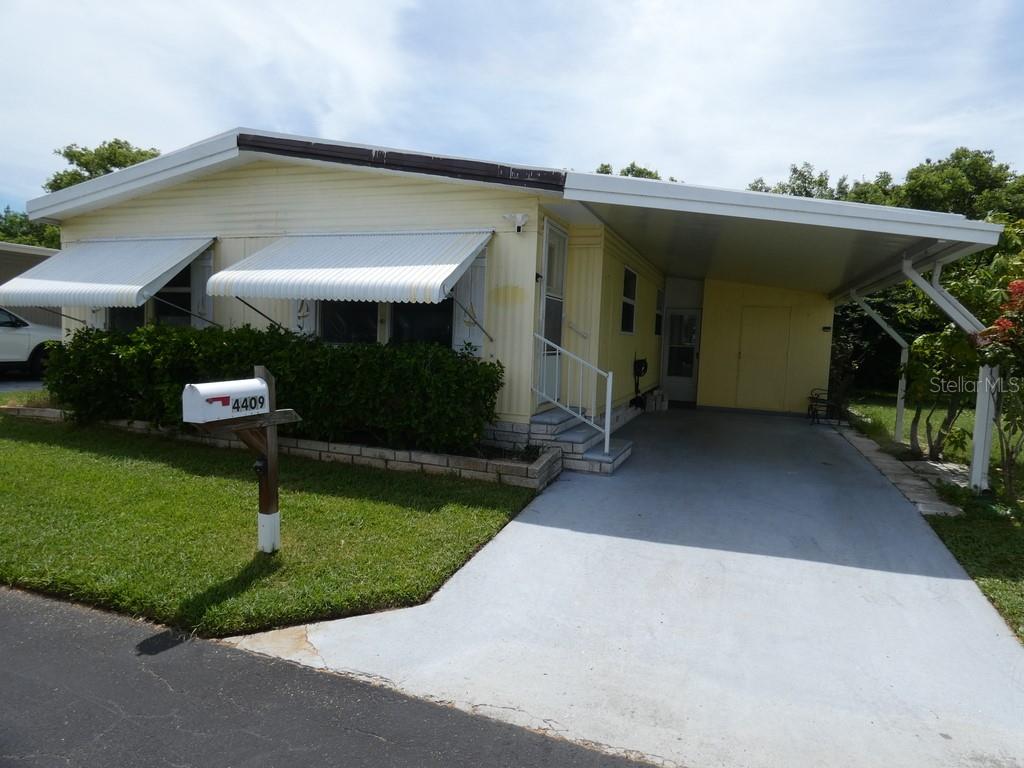 2 Bedroom, 2 Full Bathrooms, This Home has been Completely, Professionally Rehab with Class, Oversized 1 Car Carport, 2025 AC unit in this home, 2025 Appliances, All New Cabinets, No Carpet, Top of the line Granite. This Home is Magnificent, All in One Washer Combo Dryer Inside Closet: We Dare you to View this Home:) Clubhouse is five houses down. Beautiful pool shuffleboard bocce ball area, Pool table in the clubhouse, Huge kitchen gas grill, a view of the Pond, very clean, comfortable relaxing resort like feeling. Less than 43 miles to St. Pete Beach In Florida was just named The #1 Beach in America and the Fifth Best Beach in The World. Please view two videos: Tour 1 & Tour 2
