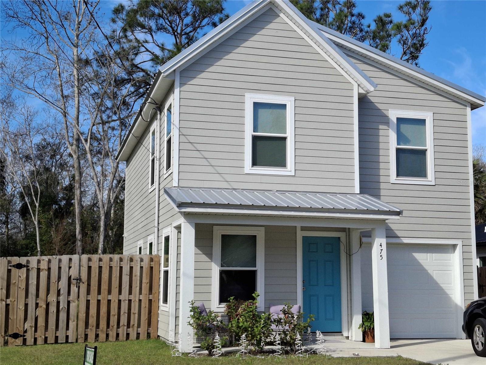 Beautiful 2 story 3 Bedroom, 2.5 Bath home built in 2023 and is located close to town with great access to all of St. Augustine's restaurants, attractions and more! Large open living and dining room with a spacious kitchen overlooking the great fenced back yard. Modern kitchen with featuring stainless steel appliances, granite countertops and sleek white cabinets any concerning cook will enjoy cooking in. This large fully fenced private backyard great for kids, pets and a private getaway! Beautiful vinyl plank flooring throughout the downstairs makes clean up a breeze. The attached one car garage and interior laundry room are a few of the other perks. The metal roof and Hardy Plank siding give you a durability for the easy maintenance.