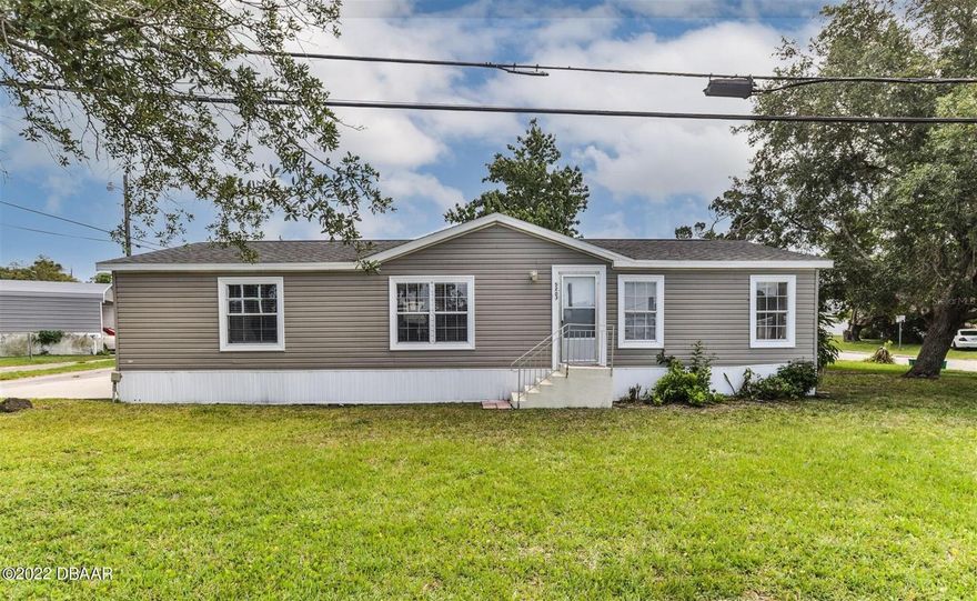 Finally an affordable 3 bedroom 2 bath on an oversized corner lot with NO LOT RENT and NO HOA! New roof 2015 and New A/C 2015. The Master bedroom includes a spacious bathroom with two sinks and a large garden tub. The living room has vaulted ceilings and is perfect for entertaining with a built in entertainment center. This model's layout offers a perfect split floor plan for privacy. Unlike most models this one offers an indoor washer and dryer. Last but not least, the location of this property is just a short walk to the river, close to shopping, great restaurants, the BEACH and Zoned for Port Orange Elementary! Schedule your showing today, this one won't last long! All information is deemed to be accurate, but not guaranteed. ;Water: City