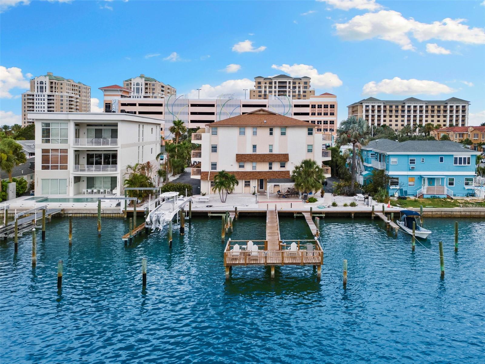 Discover an unparalleled coastal lifestyle at 479 E Shore Drive, Unit 5, a magnificent intracoastal WATERFRONT townhome nestled in the prestigious Clearwater Beach community, with a private boat slip. Enjoy water views from every room! Entering the home, you will find a thoughtfully designed living space flooded with an abundance of natural light and gorgeous views of the intercoastal waterways. This townhome offers three bedrooms, two and a half bathrooms, a 2 car garage, and a private boat slip. The open-concept floor plan creates a seamless flow from the living area to the dining space and oversized kitchen. Boasting 1,700 sq. ft. of space, this expansive retreat received many upgrades. On the ground level you have a private under-building, two car garage with laundry space for your convenience. The spacious and open second level features a large, updated kitchen with stainless steel appliances, living room, dining room, half bathroom, and balcony with water view. The next level offers two guest bedrooms with balconies and water views, a full bath, and a large walk-in closet for storage. The top level features the large primary suite and primary bathroom along with a private balcony with a water view. High ceilings and large windows/sliders throughout. Other amenities include community patio/BBQ area, fishing pier, and reserved guest parking.
3-day rental minimum! Furniture/furnishings convey. Turnkey! New Dock and pilings 2022. New dock electrical 2023. All new windows/sliders/doors 2022. New shower glass doors and toilets 2025. Garage floors epoxied 2023. New interior paint including ceilings and new carpet 2023. New tile on all balconies. Situated in one of Clearwater Beach's most sought-after locations, this home is steps from pristine white sand beaches, vibrant dining and shopping. Whether you're searching for a luxury retreat, investment property or forever home, this offers an extraordinary, rare opportunity to own a slice of paradise.