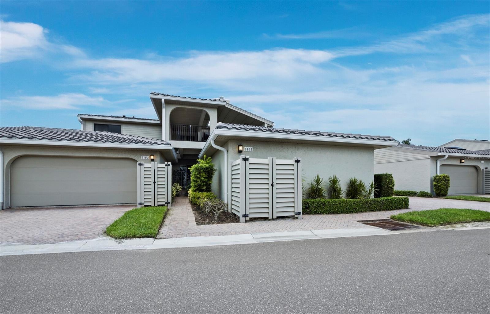 Located in the quiet, gated community of Bay Isles on Longboat Key, this beautifully renovated – FURNISHED - 2nd-floor residence in Harbour Oaks offers over 2,000 square feet of comfortable, thoughtfully designed living space. The entryway has built-in shelves and cubbies that make it easy to keep jackets, shoes, and bags organized. Inside, the main living areas feature high tray ceilings, recessed lighting, and warm wood floors, creating a clean and open atmosphere. Large windows let in plenty of natural light, giving the space a bright and airy feel. The kitchen has been fully renovated with modern finishes, including quartz countertops, a 36-inch induction cooktop, KitchenAid stainless steel appliances, a wine fridge, and a large island with a waterfall edge. A skylight above adds to the open feel, bringing natural light to both breakfast nook and separate dining area. The living room leads out to a screened terrace with spectacular views of the golf course and pond - an ideal spot to relax or catch up with friends. The primary suite includes direct access to the terrace, soft carpet, vaulted ceilings, a custom walk-in closet, and an en-suite bath with dual sinks, a walk-in glass shower, and another skylight for natural light. Two additional bedrooms provide flexible space for guests, work, or hobbies. Living in Bay Isles includes access to private deeded beach access through the Bay Isles Beach Club. Optional membership to the Longboat Key Club provides access to 45 holes of championship golf (plus driving ranges with free balls and pro shops), 20 Har Tru tennis courts with resident pros and clinics, six private member-only restaurants and lounges, and a full-service marina (Moorings) with boating access to Sarasota Bay.
