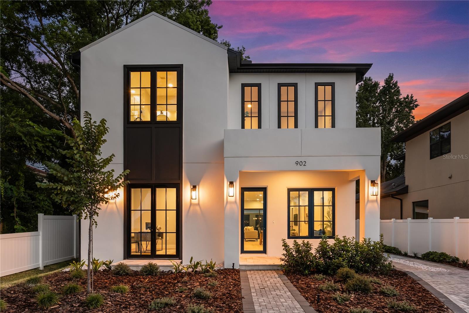 Stunning new architectural statement by LUIH Luxury Homes, ideally located in the heart of College Park, just steps from the boutique-lined charm of Edgewater Drive. From the moment you arrive, the home commands attention with its striking facade, meticulous landscaping, and a rare detached two-car garage set behind a private, extended driveway. Inside, soaring ceilings, expansive glass doors, and designer lighting create a bright, open flow, while finishes ensuring every inch feels custom and refined. At the heart of the home, the chef’s kitchen is both a showpiece and a culinary dream, featuring waterfall-edge quartz countertops, professional-grade Thermador appliances, custom soft-close cabinetry, and a designer wet bar with integrated wine refrigeration and subtle LED underlighting. Whether hosting a formal dinner or an intimate gathering, the seamless transition between kitchen, dining, and living spaces offers the ultimate entertaining experience. The primary suite is a private sanctuary, bathed in natural light and designed for the most discerning tastes. The spa-inspired bathroom showcases a freestanding soaking tub framed by exquisite tilework, an oversized walk-in shower, a spacious walk-in closet, and dual vanities. Additional upgrades include a spacious downstairs sitting room, an upstairs loft, and a spacious walk-in pantry. Located just steps from an array of locally owned restaurants, boutique shops, lush parks, and highly rated schools, this home offers an unmatched quality of life. You are also just minutes from the brand-new Packing District which features a 10-restaurant food hall, a new YMCA, and a 45,000 square foot rock climbing facility. This is more than just a home, this a masterwork of location, design, and lifestyle.