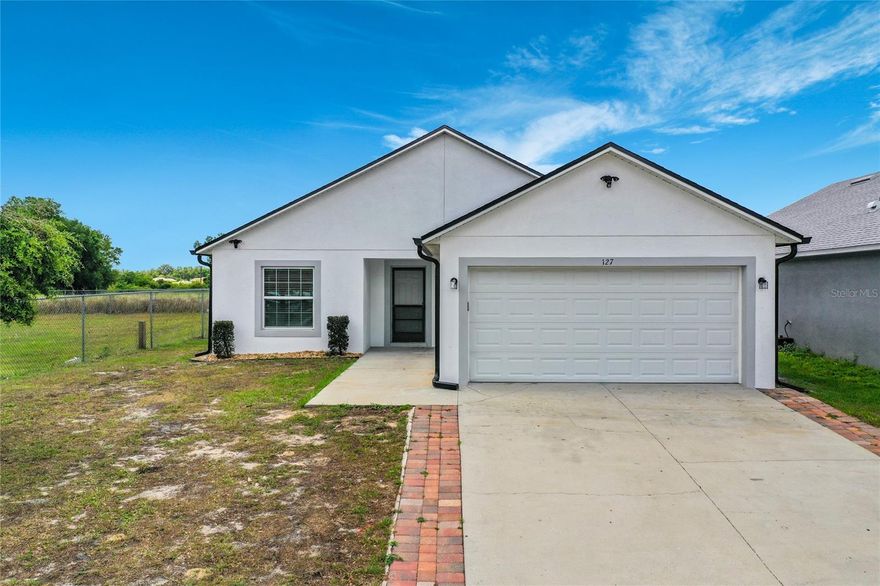 Welcome to this beautifully maintained 3-bedroom, 2-bathroom home in the growing community of Groveland. The kitchen features ample cabinetry, generous counter space, and a layout that has kitchen and dining areas. The primary suite provides a private retreat with a well-appointed en-suite bathroom and plenty of closet space. Two additional bedrooms offer flexibility for guests, family and/or home office. Outside, enjoy a well-kept yard with room to relax or personalize to your liking. The attached two-car garage and wide driveway provide plenty of parking and storage options. Located in a quiet neighborhood with easy access to nearby shopping, dining, and major roadways, this home offers both tranquility and convenience. Don’t miss your opportunity to own a spacious home in one of Central Florida’s up-and-coming areas—schedule your showing today!
