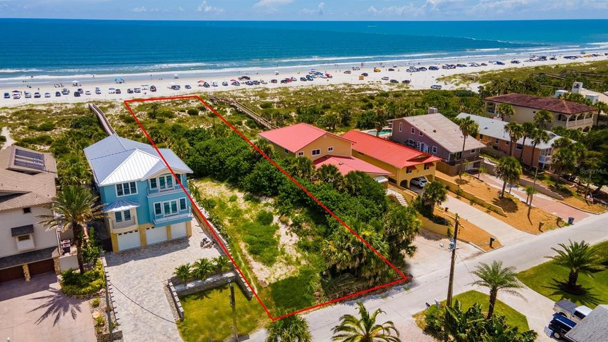 Incredible opportunity to build your dream home on this beautiful, direct ocean-front lot, located in one of the best spots in New Smyrna Beach.  High elevation offers panoramic Atlantic views and protective rolling dunes.  Imagine endless ocean breezes and spectacular sunrises, steps from the sand on coveted North Beach.  Catch the east coast’s best waves and live the endless summer you’ve always dreamed of.  Just past NSB’s last beach exit and equidistant from the serenity of the Smyrna Dunes Park and the festive shops and restaurants of Flagler Ave, this location truly has it all.  Make it yours today.; Cleared: Partial ;Water: Available at Site ;Water: City