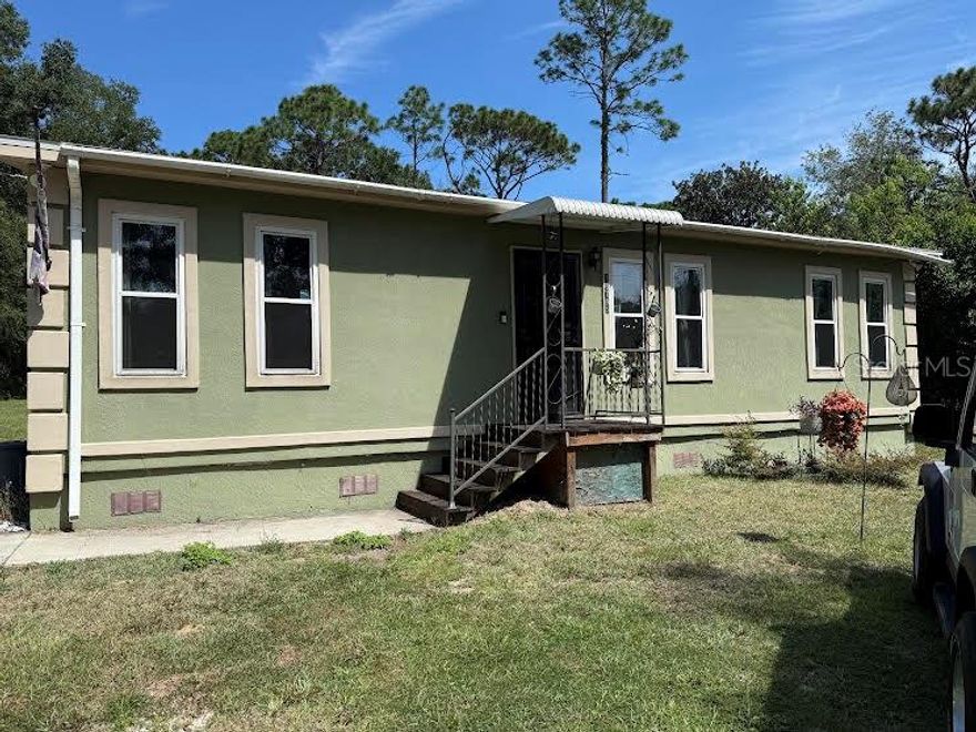 Take a look at this affordable 3 bedroom, 1 bath home located in a beautiful setting on 1+ acres of land. The wooden fence in back yard and 8x20 porch provides privacy and room to entertain. Extra storage is available in the 8x20 shed. Some furniture is included in the sale.   Come and see your new home!