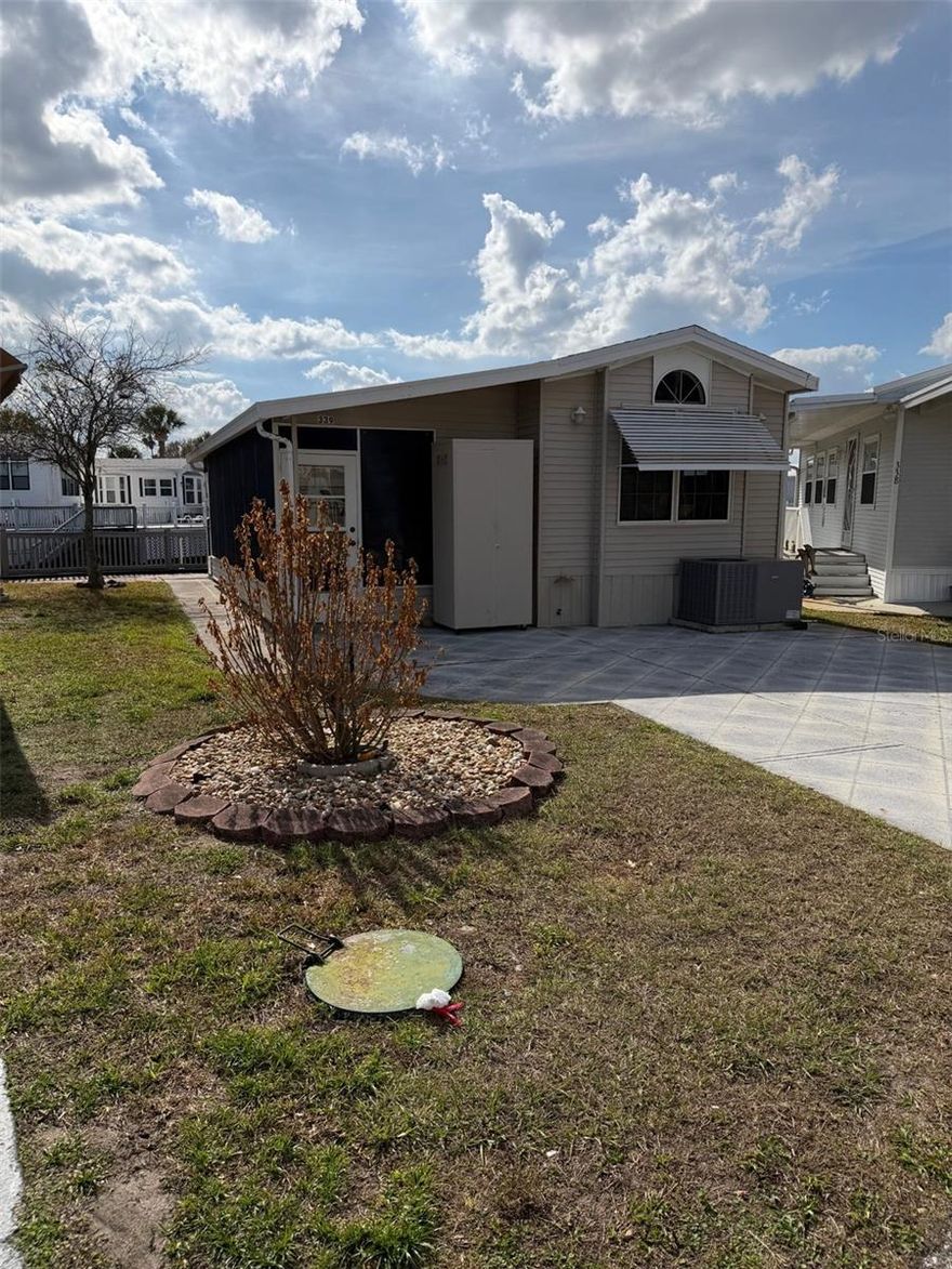 NO LOT RENT - YOU OWN THE LAND!!  Great location!!  Just a stones throw from the clubhouse and amenities and situated on the canal, this 1 bed, 1 bath home enjoys a view of the fountain from the pavered patio area and is being sold furnished and equipped as seen ***. NEW ROOF 2023 and A/C 2022 *** Come and experience the fantastic lifestyle that this unique community offers. Amenities include 2 heated swimming pools; private access to a 179 acre lake (Lake Davenport); 9 hole golf course; tennis; pickleball; shuffle board; 9 hole putt-putt golf; 8 bath houses scattered throughout the community; laundry facilities; beautiful 2 story clubhouse offering an endless array of entertainment throughout the year. All of this for the low Association Fee of $768 per quarter which also includes Cable TV, Lawn Mowing, Sewer, Trash and Water. UNBELIEVABLE VALUE FOR MONEY - you won't find a more AFFORDABLE LIFESTYLE !!!!  Please remember 55+, no VA or FHA financing, 1 pet rule. The park benefits from close proximity to Disney, medical facilities, restaurants & grocery stores. Don't delay!! Put this home on your 'must see list' and ask to arrange a viewing today.