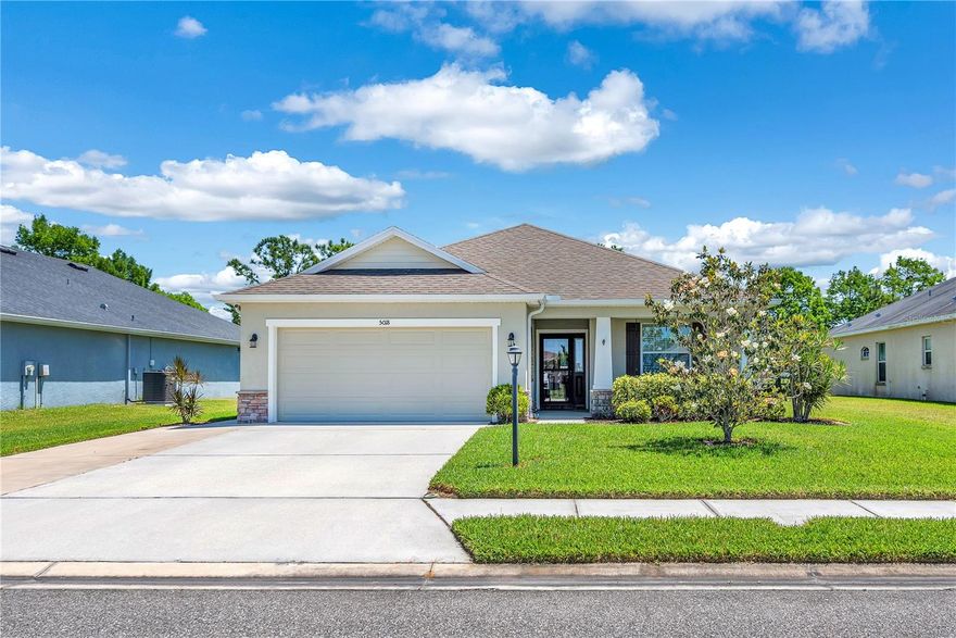 Welcome to Amber Glen! Must see well maintained move-in ready 3 beds, 2 baths, and a 2 car garage. Open concept floor plan features tile flooring throughout the foyer, kitchen, and dining / living room.  The well-appointed kitchen features beautiful cabinetry, custom backsplash, island / breakfast bar, pantry, and full appliance package. Just off of the kitchen you have the living area and dining area which is the perfect setup for entertaining. A spacious master bedroom features a large walk-in closet with an en-suite bath with dual sinks and a walk-in shower. The split floor plan allows privacy from the primary bedroom and guest bedrooms. Some other notable upgrades include crown molding, extra insulation, home is wired for a generator, full rain gutters, extended driveway with side path and garage entry door, and hurricane shutters. The laundry room is convenient to the kitchen with an entry into the 2 car garage. Washer & Dryer included. French doors lead out to covered & screened in lanai. The backyard features an extended paver patio and is fully fenced. This home is situated close to access to I-75 and I-275 so you have quick access to St. Pete, Tampa or Sarasota. With no CDD fees and low HOA costs don't wait and miss out on your chance of living in such an affordable home!