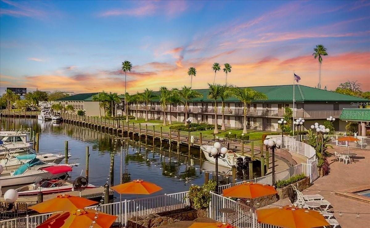 Say hello to your Florida escape at Sarasota Cay Club—where flip flops, sunshine, and rental income all go hand in hand! This 1 bedroom, 1 bath 2nd FLOOR condo-hotel unit has NO STORM DAMAGE and comes TURNKEY FURNISHED with 2 comfy beds, updated finishes, a BRAND NEW AC UNIT and all the essentials for you (or your guests) to dive straight into vacation mode. With NO MINIMUM RENTAL RESTRICTIONS, you can enjoy the unit whenever you like and rent it out the rest of the year for effortless income through AIRBNB, VRBO, or the onsite program. The highlight? These buildings surround a FULL-SERVICE MARINA with DIRECT GULF ACCESS. Step out your door and onto the dock and onto your boat, into a kayak, hop aboard a fishing charter, or simply sip something tropical while watching the sunset over the water.
As part of the Ramada by Wyndham Sarasota Waterfront Resort, you’ll enjoy AMENITIES GALORE: heated waterfront pool, Tiki Bar & Grill, volleyball courts, fitness center, kayak rentals, and plenty of space to soak in that laid-back, toes-in-the-sand lifestyle. Onsite staff is available for housekeeping, laundry, and supply restocking, so turnover between guests is a breeze. Monthly HOA fees cover ALL UTILITIES—Electric, Water, Cable, Sewer, Trash, Pest Control and Insurance—keeping your costs simple and predictable.
Just minutes from Sarasota Airport, downtown Sarasota, and world-famous beaches, this is more than a condo—it’s your ticket to fun, sun, and profit on Florida’s Gulf Coast.
Prime location: minutes to SRQ Airport, downtown Sarasota, St. Armands Circle, IMG Academy, Anna Maria and Siesta Key Islands. Whether you’re seeking a turnkey vacation base, an income producer, or both, this unit delivers coastal convenience and revenue flexibility in one of Sarasota’s most accessible waterfront settings.