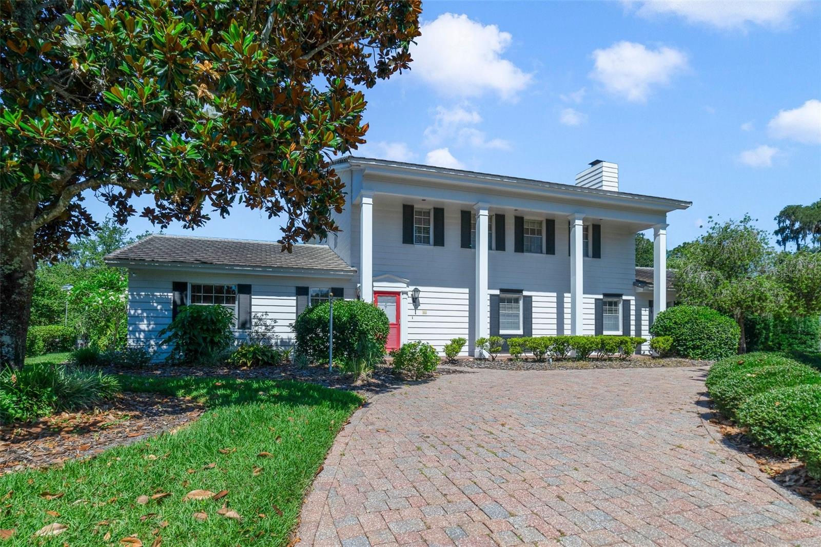 Welcome to your dream lakefront home in the prestigious Sevilla neighborhood of Winter Park. This stunning five-bedroom, two-and-a-half-bathroom residence exudes classic charm and offers a picturesque setting on the serene shores of private Lake Sue. The beautifully landscaped front yard enhances the home’s curb appeal, welcoming you with vibrant greenery that complements the classic façade.
Step into the formal entryway, where a sweeping staircase sets the stage for the elegance that flows throughout this home. The formal living room invites you to relax and entertain in style. Adjacent, the dining room features sliding glass doors that open to captivating views of the pool, creating a seamless blend of indoor and outdoor living.
A charming swinging door leads to the vintage kitchen, brimming with potential for your personal touch. The spacious family room is a cozy retreat, boasting a wood-burning brick fireplace flanked by built-in bookshelves, perfect for family gatherings and quiet evenings.
Hardwood flooring runs throughout the downstairs living areas, adding warmth and character to each room. One of the highlights of this home is the cozy downstairs bedroom, which features beautiful wood-paneled walls. The rich, natural tones of the wood create an inviting atmosphere, making it a perfect retreat for relaxation, a guest room, or a private home office.
Upstairs, the floorplan includes a primary bedroom with double vanities and closets. Three additional guest bedrooms and one full bathroom complete the upstairs layout. The master bedroom, along with two of the guest bedrooms, offers delightful views of the pool and the sparkling lake.
The backyard is a true oasis, featuring a refreshing pool and convenient rear entry garage parking. With 30 feet of lakefront access, you'll enjoy endless days of boating and water activities. The dock and boat house are ready to accommodate your boat of choice, making lakeside living a breeze.
Experience the perfect blend of classic design and lakefront luxury in this exceptional Winter Park home. Schedule your private tour today and discover the timeless appeal and endless possibilities of this Sevilla gem.
