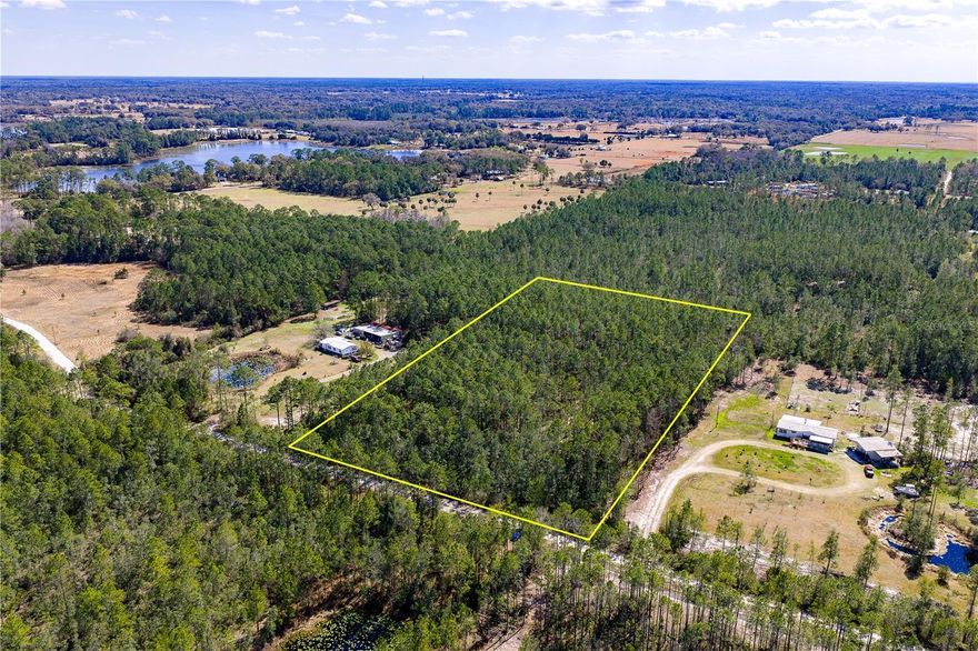 High and dry 5-acre parcel in De Leon Springs with no wetlands and no flood zone. Fully wooded and untouched, this parcel offers privacy and flexibility to build your custom home in a quiet rural setting. Peacefully located in Volusia County, with convenient access to DeLand, major roadways, Daytona Beach (approx. 35–40 minutes), and Orlando International Airport (approx. 1 hour 15 minutes). Bring your builder and your vision. Buyer to verify all development requirements, utilities, and land use.