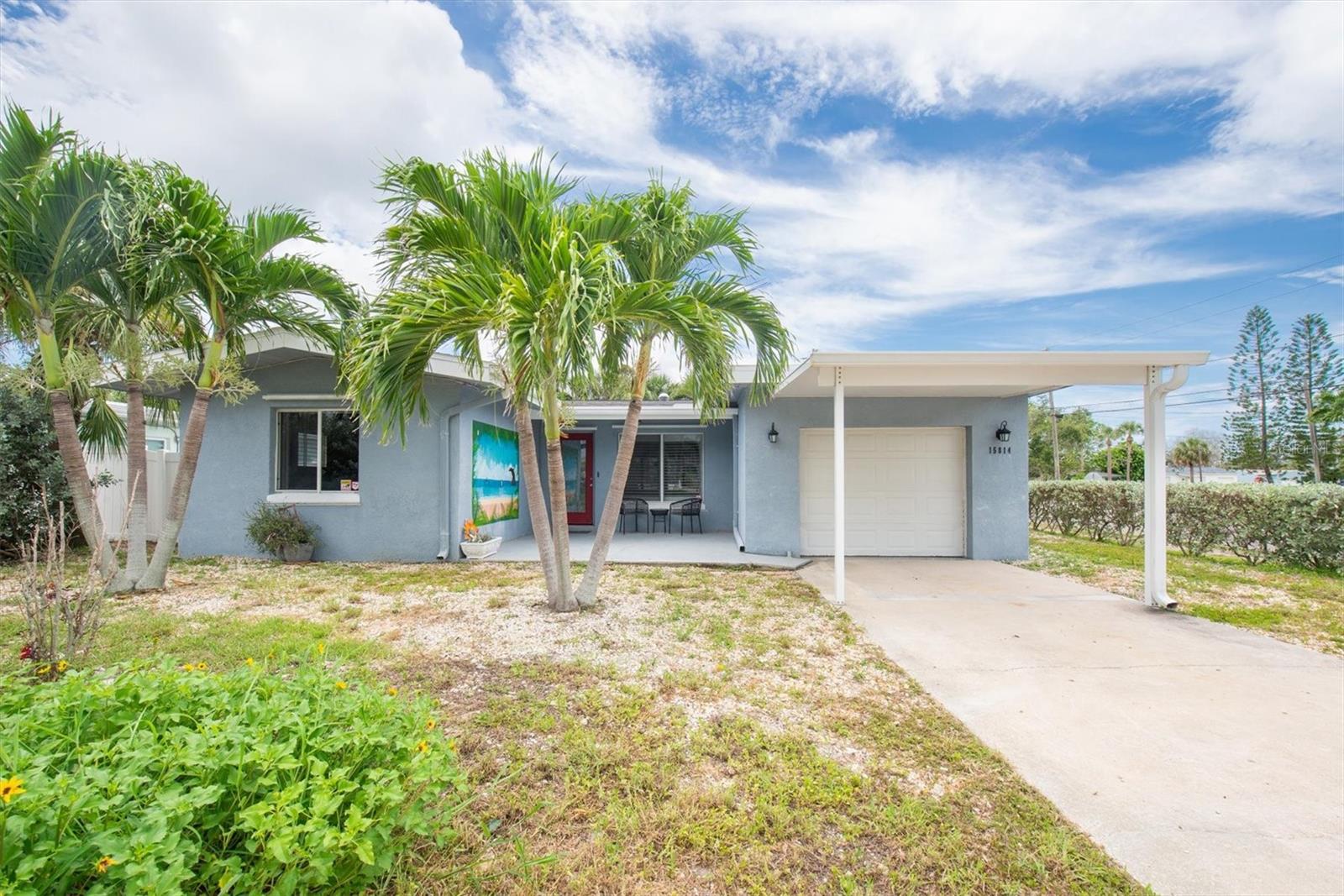 This adorable beach cottage sitting on a coveted corner lot with lush surroundings should be your next endeavor. The opportunities are endless. This home was designated NOT SUBSTANTIALLY DAMAGED, however, if one tore it down and built anew or lifted the existing structure; imagine the potential water views and breezes that would cascade through the home. Combined with the short term rental allowed in Redington Beach this would be a fantastic venture for the savvy investor or beach lover. Speaking of beach, this property is about ten homes from the special Redington Beach parking lot for residents only. In addition this area is a lovely beach access. Imagine on a hot day taking your car or golf cart to beach with free parking. While this home had storm damage like many in the area, this home has many positives. The plumbing pipes under the house have been redone, the windows and doors are updated with storm shutters, and the house has been completely mitigated and ready for your upgrades . If one keeps the kitchen footprint the white quartz is ready to be installed. While all of these possibilities are amazing the seller is selling at land value only.