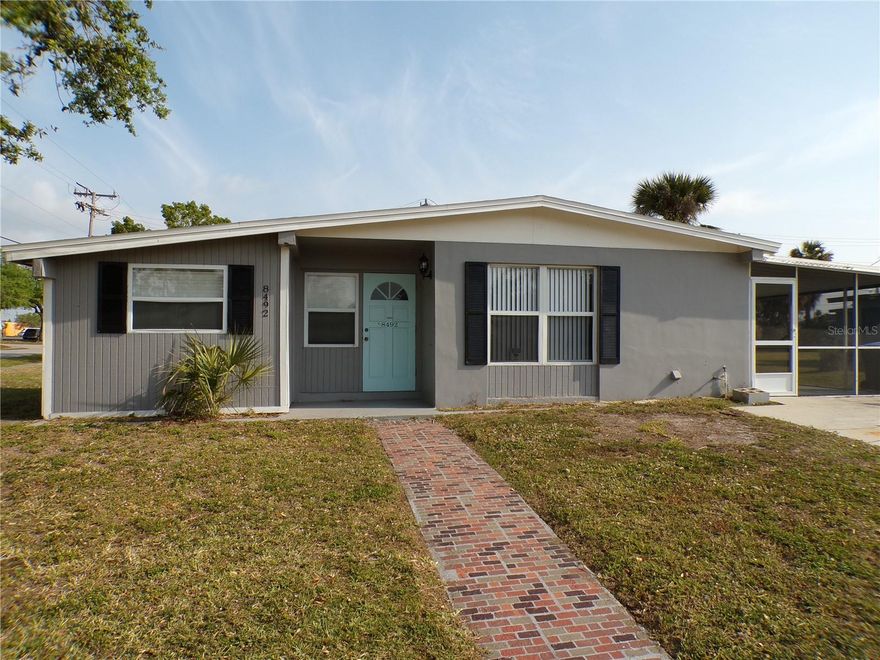 Great new rate on this beautiful 3 bed 1 bath home with BONUS room now available for annual lease.  Freshly painted with a complete bathroom remodel and all new flooring this beauty has granite and stainless in the kitchen and a huge screened lanai.  Situated on a large corner lot with city water and sewer in a quiet neighborhood, this home is move in ready.  Washer and dryer are provided and there is a large storage room off of the lanai.  Your rent includes lawn maintenance so you can sit back and enjoy this Paradise location.