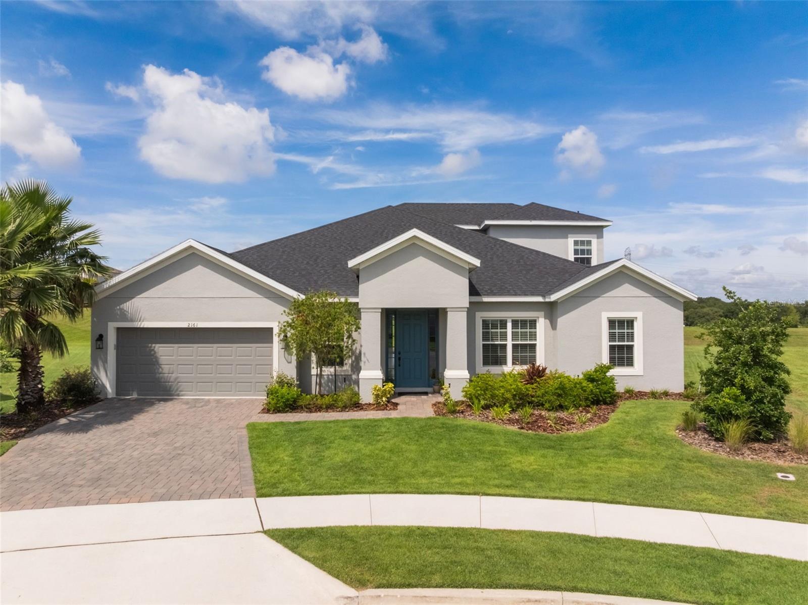 Experience the ease of a move-in-ready home with all the benefits of new construction—without the wait. Tucked away on an oversized cul-de-sac lot with no rear neighbors, this home was built less than two years ago and offers a flexible, family-friendly layout with all the extras. Step inside to a chef-inspired kitchen featuring a gas range, double ovens, quartz countertops, a touchless sink, and invisible sliding glass doors that open up to create a seamless indoor-outdoor living experience. There’s a dedicated home office, a butler’s pantry, a media room with built-in speakers and an upstairs game room/flex space ready to fit your new lifestyle. The tandem 3-car garage is ideal for multi-generational living, car enthusiasts, or anyone who needs extra storage and elbow room. Talk about the perfect location, you’re in the heart of South Lake County, just steps from top- A rated schools like K-8th Pinecrest Lakes Academy and Lake Minneola High, and only 5 minutes from the brand-new Minneola Horizon Academy K-8th charter school. Need to commute? You're less than five minutes from the Turnpike with direct access to Orlando. And here’s the cherry on top: No CDD fees. You’re also just minutes from the brand-new AdventHealth hospital, the upcoming Crooked Can Brewery, retail, restaurants, shops and all the exciting growth happening in Minneola.
Modern design, stunning upgrades, prime location, and no extra CDD—this one checks every box. Your dream home is ready—book your private showing and make it yours.