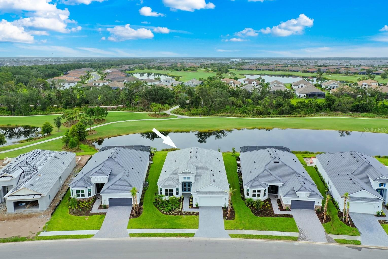 Welcome to Your 2025-Built DEEDED Golf Paradise in Esplanade at Azario! Imagine waking up every day to panoramic SOUTH, WATER, GOLF, and PRESERVE VIEWS—this is your chance to own one of the most coveted homesites in the community! This brand-new, light-filled Pallazio floor plan offers 3 bedrooms, 3 full bathrooms, and a spacious den, perfectly blending luxury, comfort, and Florida resort-style living.
From the moment you step through the glass front doors, you’ll notice the thoughtful attention to detail. Just a few of the many high-end touches include tray ceilings, crown molding, Level 6 & 7 designer tile throughout (no carpet!), and solid wood 8’ interior doors. Neutral tones and upscale finishes make the entire space feel calm, inviting, and sophisticated. (Please ask to see the upgrades/feature sheet.)
The gourmet kitchen is a true showstopper—complete with Monogram appliances, a white apron-front sink, quartz countertops, under-cabinet lighting, a prep sink with garbage disposal in the oversized island, and a built-in Café beverage fridge. Whether you're entertaining or unwinding, the open great room—equipped with pre-wiring for electric roll-down shades, a floor outlet, and sliders leading to the extended lanai—is ready for it all. The outdoor space is equally impressive with the extended covered lanai, perfect for enjoying the Florida lifestyle year-round. Plus, the home is pre-plumbed for an outdoor kitchen and pre-wired for a pool, making it easy to customize your dream backyard oasis. The split bedroom layout ensures everyone enjoys their own space and privacy. The primary suite is a serene retreat, featuring bay windows, dual walk-in closets—including an oversized closet perfect for designing your dream dressing room—and a luxurious spa-like bath with a frameless glass shower, multiple shower heads, and unique tilework extended all the way to the ceiling. The front guest bedroom lives like a private suite, featuring a beautiful bay window and a pocket door that creates an en-suite setup with the nearby bath—complete with ceiling-height wall tile and unique floor tile for a designer touch. The second guest bedroom is generously sized to accommodate a king bed and offers its own full en-suite bathroom, also finished with ceiling-height tile and a sleek frameless glass shower, providing a luxurious experience for guests or family. Additional upgrades include natural gas, a tandem 3-car garage, impact-rated windows and doors, tankless water heater with recirculation loop, WiFi extenders, a built-out laundry room with utility sink, and much more. Step outside your front door and into the resort lifestyle Esplanade is known for. Enjoy a championship 18-hole golf course, full-service clubhouse & restaurant, tiki bar, resort-style pools, fitness center, spa, tennis, pickleball, walking trails, and endless social events and clubs. HOA dues include your golf membership, lawn care, irrigation, and gated access—truly maintenance-free living. This is more than just a home—it’s the lifestyle you’ve been waiting for. Welcome to Esplanade at Azario, where every day feels like vacation. Call today for your private showing. PLEASE CLICK THE LINK FOR A VIDEO OF THE HOME / LIFESTYLE.