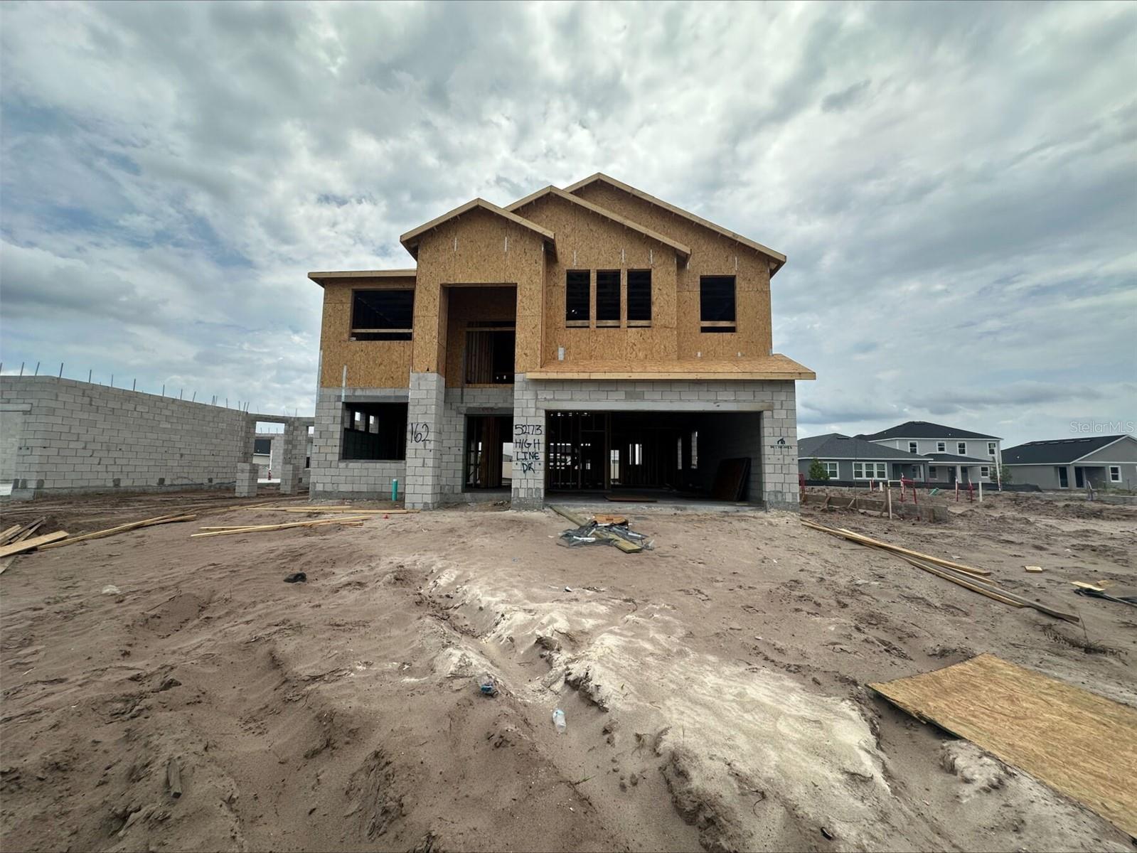 Under Construction. Discover this exceptional new construction home for sale at 5273 High Line Drive in Saint Cloud. This spacious home offers 5 bedrooms, 4 bathrooms, a flex room, a loft, an 11' x 8' lanai, a 3-car garage, and so much more! This beautiful home combines functionality with style, featuring well-appointed spaces that flow seamlessly from one area to the next. The kitchen serves as the heart of the home, opening to comfortable living areas that encourage connection and conversation. The thoughtfully designed floorplan maximizes usability while maintaining a sense of openness. Upstairs off the loft, your owner's bedroom offers a peaceful retreat with its own dedicated bathroom. The additional bedrooms provide comfortable accommodations for family members or guests. As a new construction home, everything from the fixtures to the systems are brand new, offering peace of mind and minimal maintenance concerns. Make your new home dreams come true at 5273 High Line Drive!