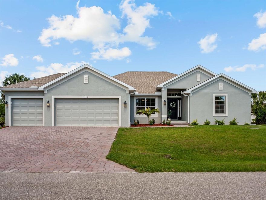 Built in 2025, this 4 bedroom, 3 bathroom South Gulf Cove home sits on 80 feet of Red Hook Waterway frontage with direct lock access. One bridge to clear and you're at the SGC lock, then the Myakka River, Charlotte Harbor, and the Gulf. Your boat isn't waiting on a dream. It's waiting on you.

Step inside and the open feel hits immediately. Ceramic plank tile runs through the entire home. The kitchen earns attention with quartz countertops, upgraded cabinetry, and stainless steel appliances. This isn't a starter finish package. The primary suite has a step ceiling, walk-in closet, and a spa-style en suite with a 5-foot tiled shower. Two more full bathrooms serve the remaining three bedrooms with the same quality throughout.

Slide open the doors of your pocket slider. Your 24x10 screened and covered patio looks straight out at 80 feet of saltwater canal. That view doesn't get old.

Outside: paver driveway, Bahia sod with irrigation, and a 3 car garage on a 10,000 square foot lot. South Gulf Cove has a community boat ramp and a voluntary HOA at just $120 a year.

This one comes fully furnished. Every piece of furniture, all appliances, both 2 TVs, the garage workbench, and the storage rack all convey. You're not starting from scratch. You're just moving in.

Turnkey waterfront homes with direct lock access at this price point don't sit long.