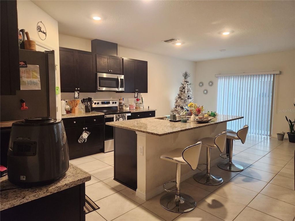 Photo of 1075 Griffon Avenue, Lake Alfred, FL 33850 (MLS # TB8473829)