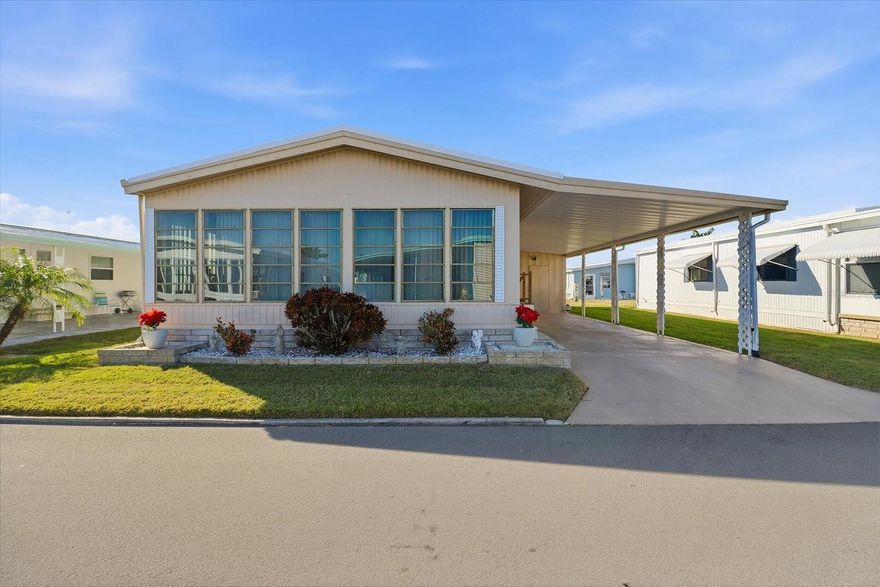 Welcome to 2045 Hilo Drive, a move-in-ready double-wide manufactured home tucked inside the gated Lake Conley community in Holiday. This 2-bedroom, 2-bath residence offers 960 square feet of comfortable living space with high ceilings and an open living and dining room combo that feels bright and easy to live in. The kitchen provides generous cabinet space and flows naturally into the main living areas, creating a functional layout for everyday use or rental efficiency. The primary bedroom features a walk-in closet and private bath, while the second bedroom works well for guests or a home office. Step into the covered and screened porch, an inviting spot to unwind and enjoy Florida evenings. The owner's added duct work (in 2023) to this lanai where you can enjoy cooling or heating in this extra space. The home comes furnished, includes a carport and storage shed, and offers access to community amenities such as a pool, clubhouse, gated entry, fishing, and a community boat ramp. Ideal for an owner-occupant or as a long-term rental opportunity in a well-established community. Conveniently located near shopping, dining, and major roadways. HOA approval required. Buyer to verify all information. Schedule your showing today!