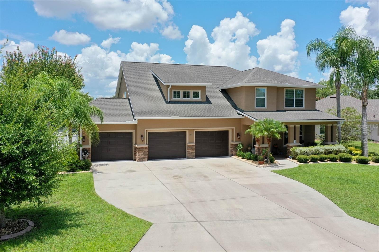 Welcome to your dream home in the beautiful Breakaway Trails community! This stunning 2-story residence offers luxurious living with 4 bedrooms, 3.5 bathrooms, and nearly 3,300 square feet of elegantly designed space. Situated in a guard-gated exclusive neighborhood, this property combines both privacy and sophistication. Step inside to find a spacious great room and dining area seamlessly flowing together, enhanced by beautiful tile flooring throughout. Triple sliding glass doors open up to a large, screened lanai and sparkling pool area, perfect for entertaining or relaxing. The chef’s kitchen is a true highlight, featuring granite countertops, stainless steel appliances, and a convenient bar for additional seating. An ensuite bedroom downstairs provides privacy and comfort, with its own bath featuring a garden tub and a walk-in shower. Upstairs, you'll find three additional bedrooms and a versatile sitting area, ideal for a home office or playroom. The laundry room is conveniently located on this floor, making household chores a breeze. This home also boasts modern conveniences including a newer water heater and microwave, dual A/C units, and newer pool screens. The expansive 3-car garage and fully fenced backyard add to the appeal of this immaculate property. Don’t miss out on this exceptional opportunity to own a piece of paradise in Breakaway Trails. This home truly offers the best in luxury living and community amenities.