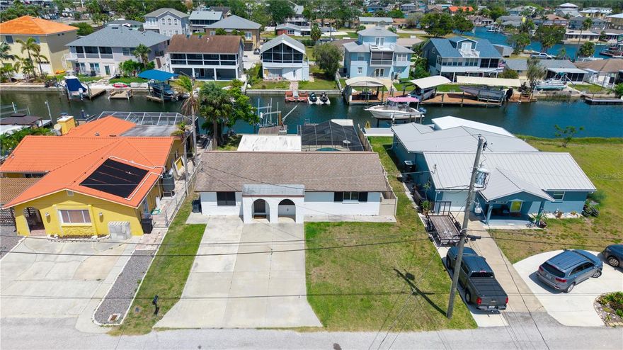 Live the Florida Lifestyle in this Fully Updated waterfront Pool home on a canal in Hudson Beach. This home Boasts a Large Florida Room, In Ground Pool, Dock & Boat Lift, Storage Shed and an oversized driveway. The primary suite has an updated bathroom and double closets. The Roof was Replaced in 2015 as well as the HVAC. You will Love this Move In Ready home located on the Gulf coast of Florida. Local attractions include Waterfront Dining, Sun West Waterfront Park, Local bars and restaurants and the New Port Richey downtown district and Railroad Square is just a short car ride away. Room sizes are approximate and buyers and buyers agents should verify.