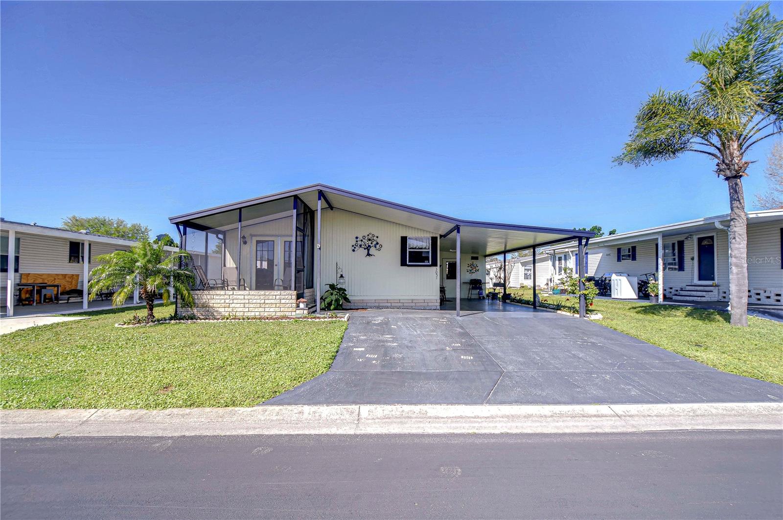 Charming 2-Bedroom Home in Gated Community: No Lot Rent! Welcome to this beautifully maintained 2-bedroom, 2-bath home in a sought-after gated community with no age restrictions and no lot rent! Enjoy a low monthly fee that covers water, sewer, garbage, lawn maintenance, security, and access to fantastic amenities—including 2 pools, 2 clubhouses, and a variety of activities. This light and bright home features a snack bar, a cozy front screened porch, and new flooring in the living room, kitchen, and bathrooms. Additional upgrades include a brand-new HVAC system (2025) and dryer (2025). A large utility storage area is located at the back of the two-car carport, offering extra convenience. The home is sold furnished, making it move-in ready with everything you need! Plus, this larger pet-friendly community (with some breed restrictions) is in a prime location—just minutes from Wiregrass Town Center, restaurants, and grocery stores. Why pay rent when you can own this charming home? Schedule your showing today!