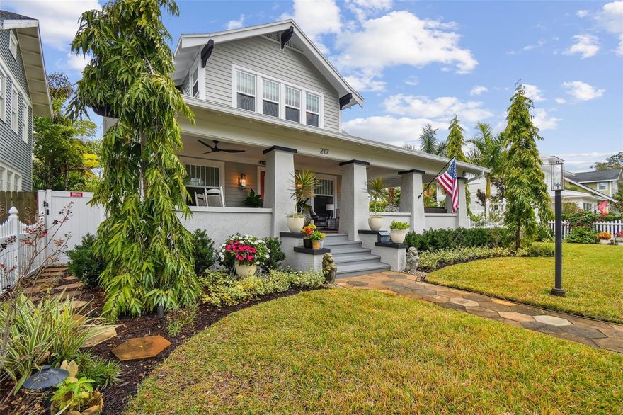 Welcome to the Florida lifestyle you've been looking for! This 1920s craftsman home has been completely meticulously renovated both inside and out. This home features, new hurricane impact windows, new exterior lighting, new fiberglass doors with impact glass, Navien tankless water heaters (main house), new HVAC, new electrical panels and wiring. Utilities and cable to the property were run underground. The spectacular salt water pool with waterfall, pebble sheen interior, and lounge pad, fully landscaped and LED lighting, and fire pit, create a backyard destination. Privacy fence, pavers, and custom cedar outdoor shower add to the yard’s resort feel. This home sits on a 75-foot-wide lot with extra parking pad behind a secured electric gate along with a 2-car garage. Newly built block guest house above the garage will welcome your guests with its vaulted ceilings and a fully functioning kitchen and bath. The main house offers a wraparound front porch restored to its original splendor with restored cuban tiles. Add to that the raised ceiling and new fans. Walk into the beautifully restored home with restored coffered ceilings, gas fireplace, river pine hardwood flooring, custom drapes, and shades on all the windows. The dining room features original crown molding, a new chandelier, and a newly added bar and wine fridge. Picture yourself in the extra large kitchen with huge island covered in Bianco Honed Dolomite marble. New sconces and pendant lighting along with high quality brass hardware, new oak flooring, and a custom coffee bar with walnut countertops and beams. Appliances are as follows: Dacor 4-door refrigerator, Viking gas range, Decor hood vent, Viking microwave drawer, Decor dishwasher, and Insinkerator disposer. Laundry room includes a Samsung washer and dryer and custom cabinetry. Primary bath and hall bath are finished in marble tiles with brass hardware (backlit mirrors in Primary bath). This home is basically brand new. You must see this home in person to appreciate its many unique features. This dream home is within a few blocks from the vibrant downtown and close to the city and its many breathtaking parks.