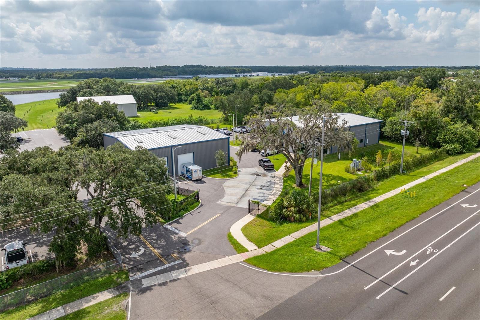 Discover an exceptional opportunity with this nearly brand-new commercial property, strategically located on 4.31 acres with immediate access to major highways including US 301, I-4, and I-75. Built in 2022, this property is a perfect fit for businesses seeking visibility, convenience, and functionality.
Prime Location: Situated just minutes from major highways, this property offers easy access to the entire Tampa Bay area and beyond. The visibility and accessibility make it an ideal location for a variety of business operations.
Modern Office Building: The 6,300 square foot office building is meticulously designed to meet the needs of modern businesses. It features 13 private offices, multiple cubicle areas, a fully equipped break room with a kitchen, 4 private restrooms, a welcoming reception area, and two spacious conference rooms. The structure is thoughtfully designed to allow the addition of a second level, providing further expansion opportunities within the existing footprint.
State-of-the-Art Warehouse: The 4,900 square foot warehouse boasts 20-foot ceilings and is equipped with three electric 17-foot overhead grade-level doors, facilitating seamless loading and unloading processes. Built for durability, the warehouse includes an upgraded concrete slab capable of supporting heavy delivery vehicles and is fully insulated with 4-inch insulation to ensure optimal temperature control.
Infrastructure: The property is equipped with 3-phase power and a 400 AMP service, ready to support a wide range of industrial and commercial activities. The warehouse's advanced lighting and electrical systems ensure efficient and reliable operations.
Ample Parking: The expansive lot includes ample parking for employees, visitors, and large vehicles, enhancing the functionality and accessibility of the property.
Zoning and Compliance: The property is fully compliant with the latest Florida Building Code (7th Edition, 2020), ensuring it meets all current safety and regulatory standards. The property is zoned for various commercial and industrial uses, making it versatile for different business types.
Investment Potential: With its strategic location, modern facilities, and expansion capabilities, this property represents a prime investment opportunity for businesses looking to establish or expand their presence in the Tampa Bay area. The potential for future growth within the property adds significant value to this offering.
Don’t miss out on this unique opportunity. Contact us today to schedule a tour and explore the potential of this exceptional commercial property.